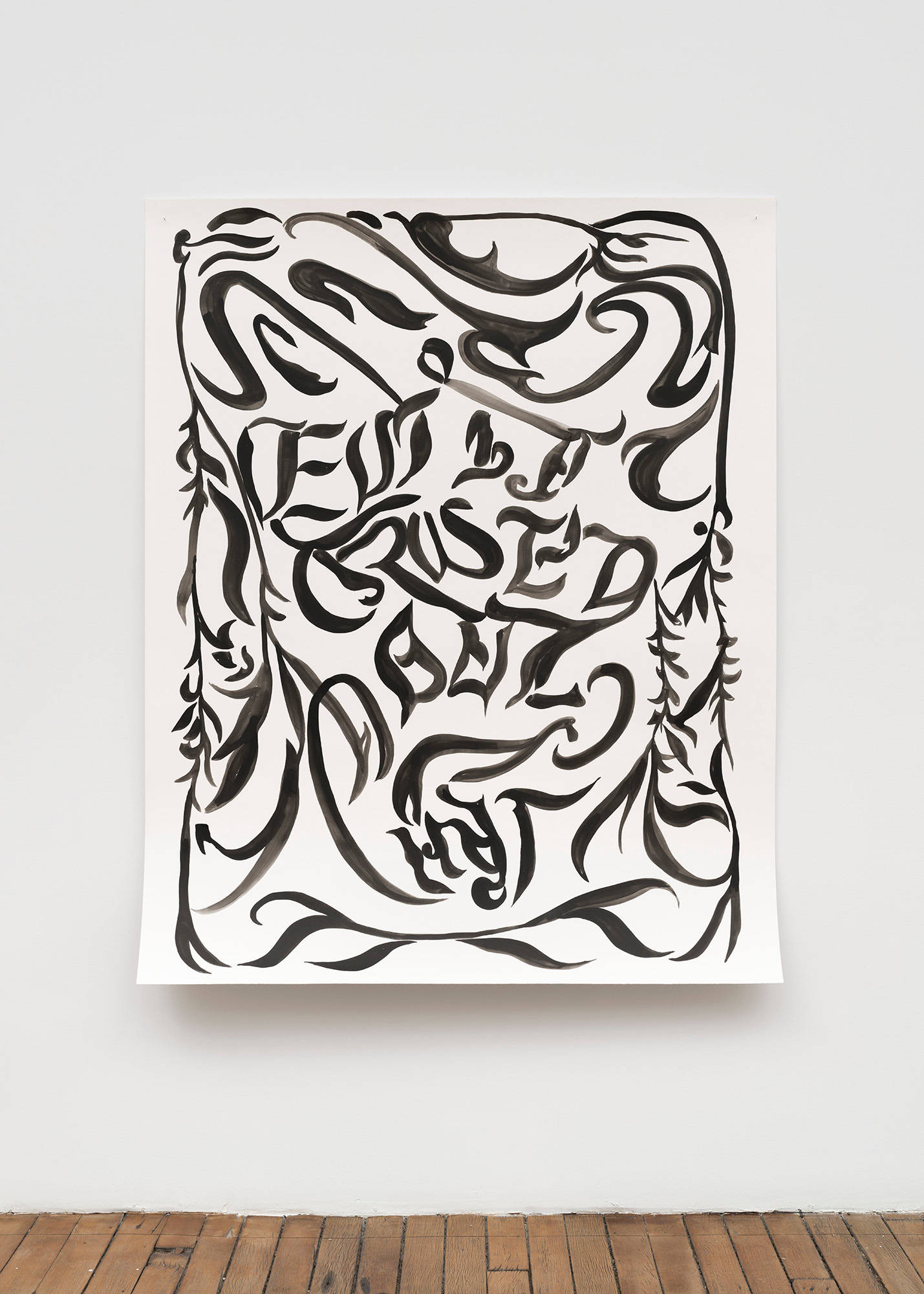A large, abstract, black ink drawing on paper hangs on a wall. Due to the use of AI to create it, it appears that there are words in gothic font visible in the drawing, but they are not legible.