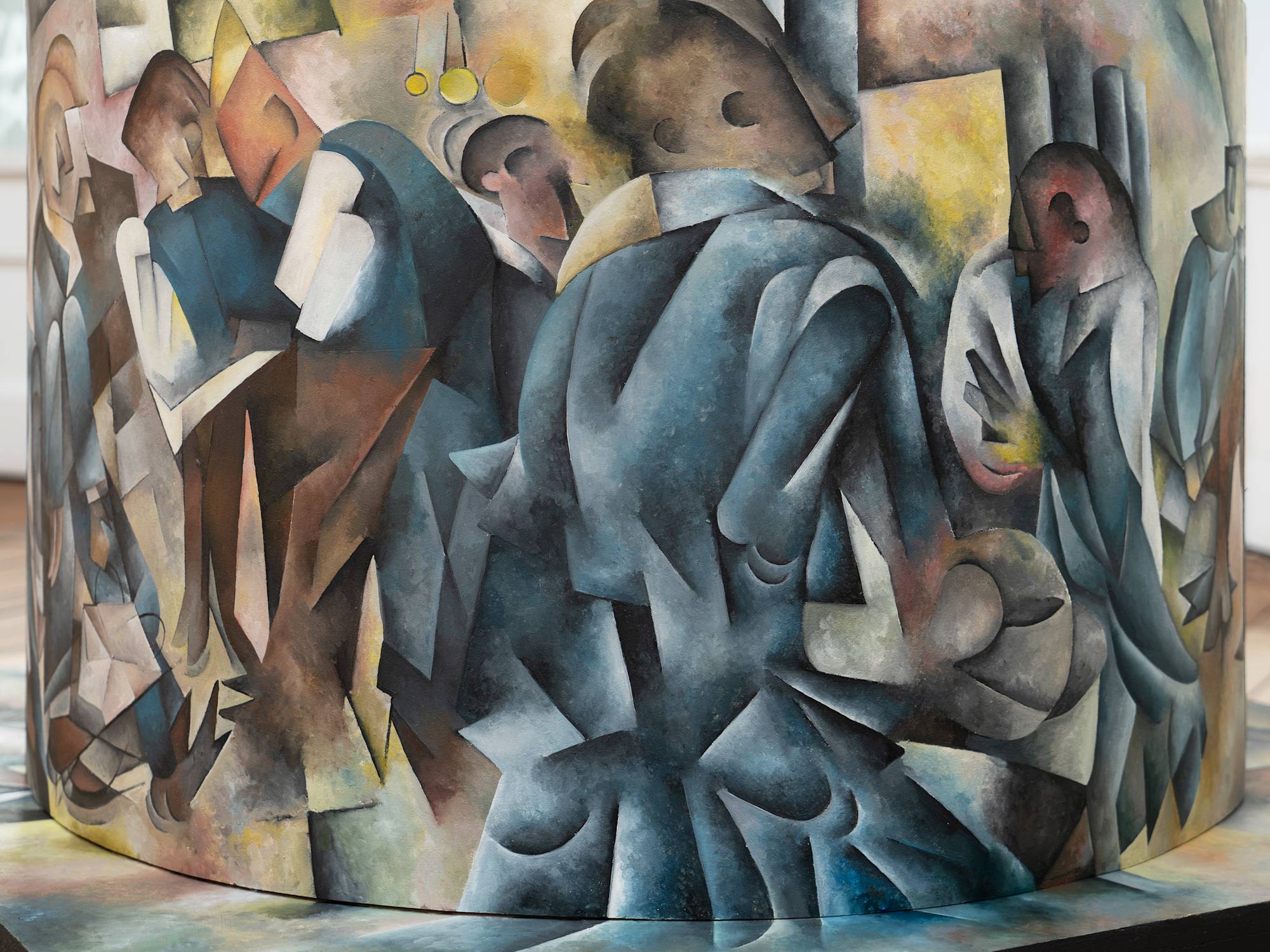 A detailed image of a sculpture painted in a Cubist style.