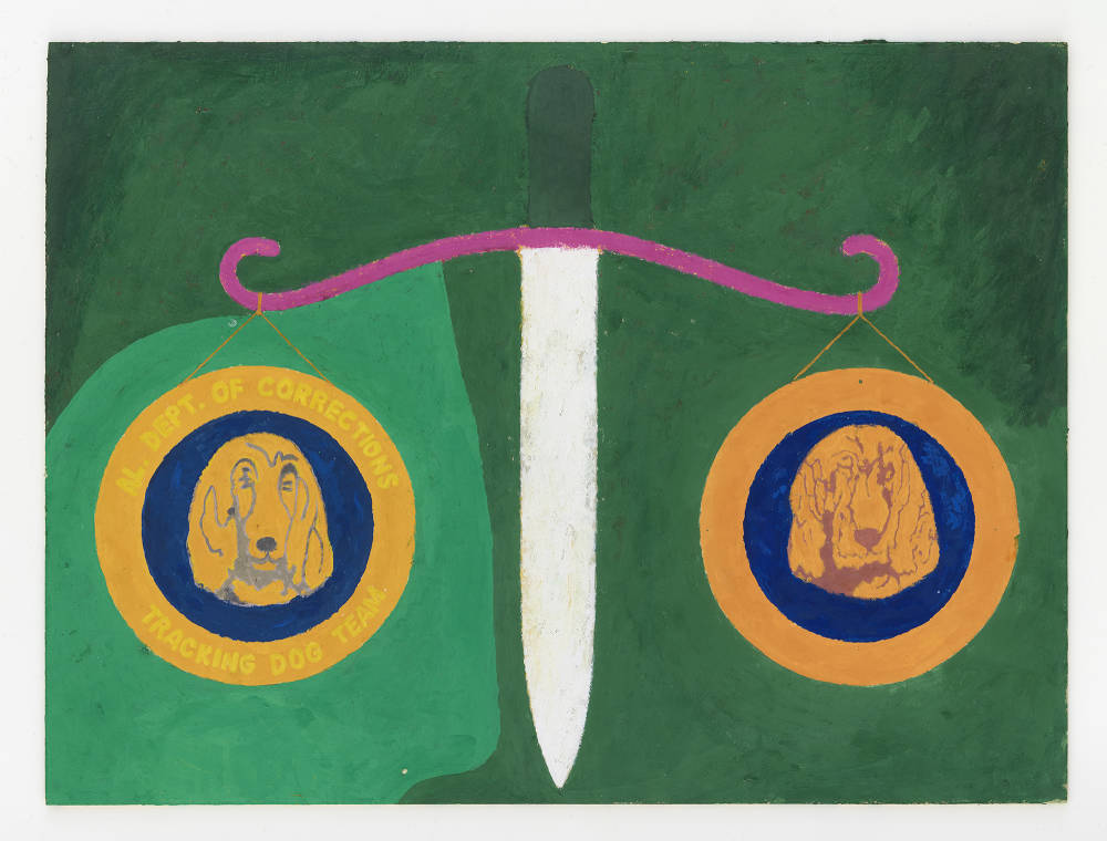 A small work on paper with a green background. In there center is a kind of scale with two weights hanging on either side with cartoon-like dogs drawn onto them. There is the text: "Dept. of Corrections Tracking Dog Team."