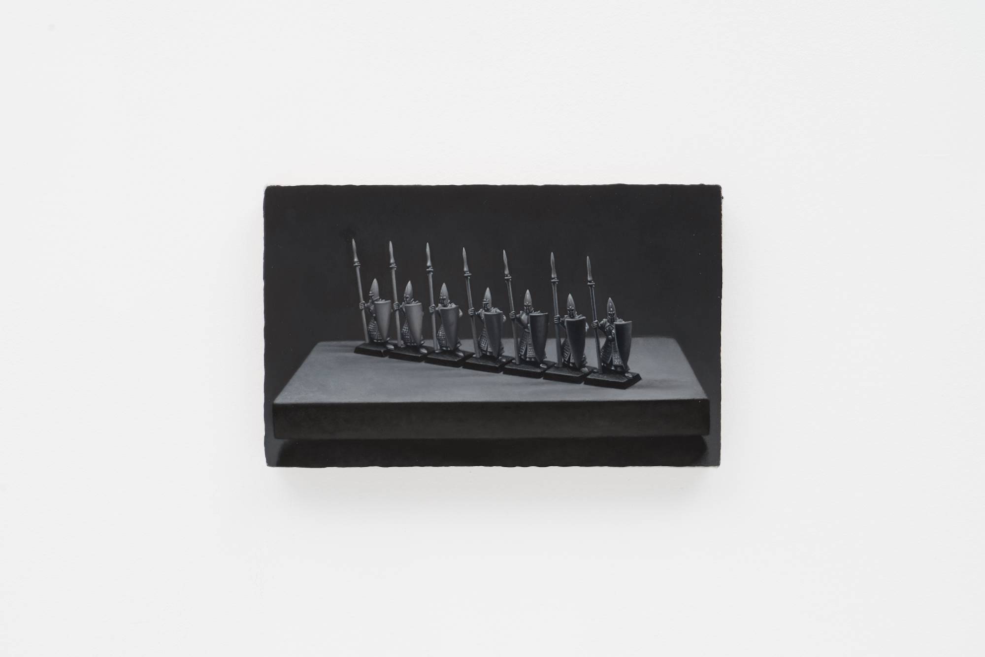 Ian Miyamura painting depicting seven unpainted Warhammer spearmen figures on a small tabletop against a black background.