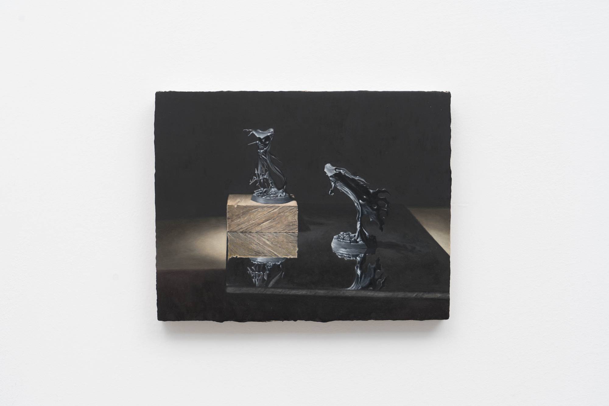 Ian Miyamura painting depicting two unpainted Warhammer figures against a black background. The figures stand on a mirror showing their reflections. There is a wood block underneath the figure on the left.