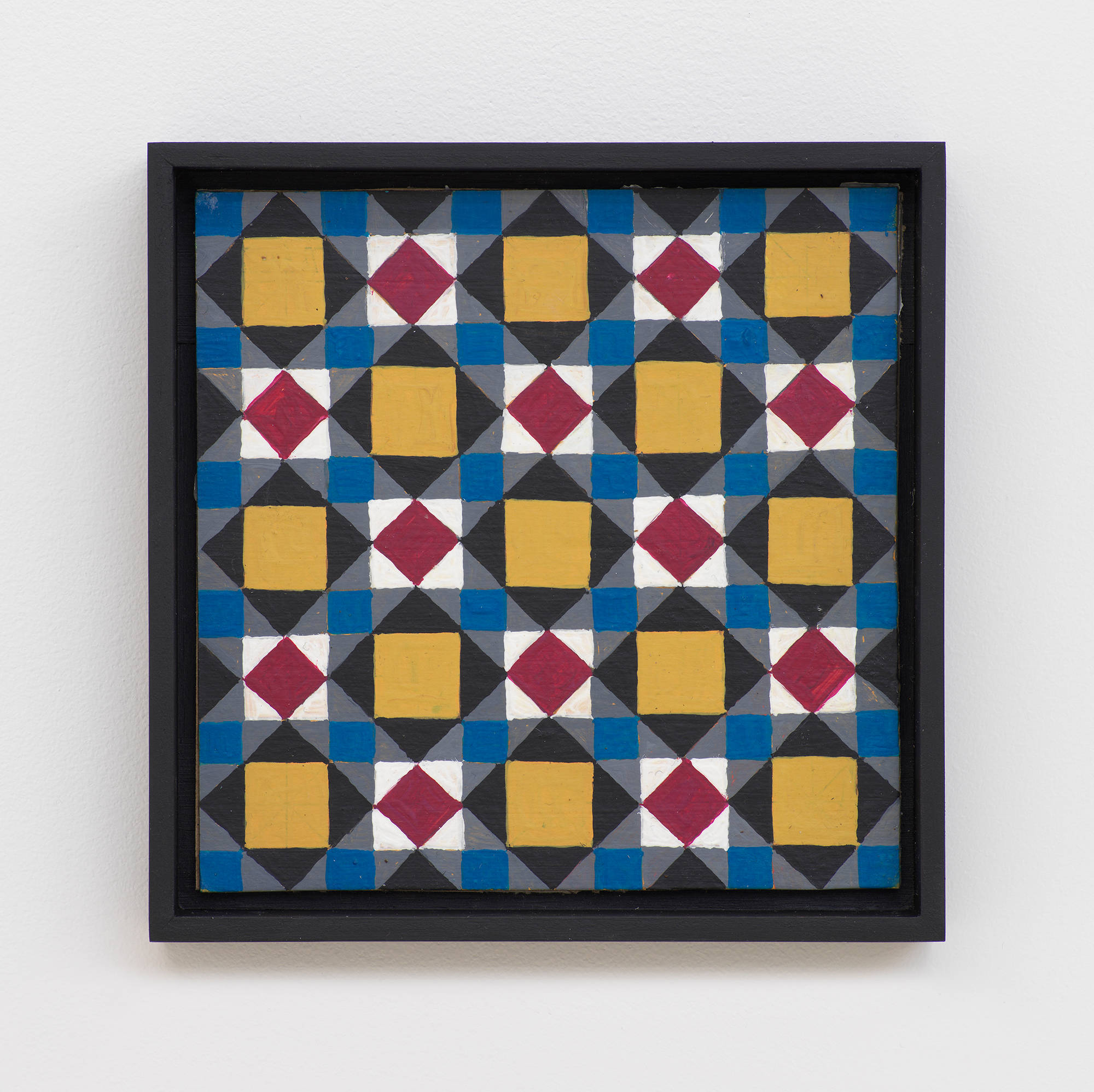 A small painting depicting a grid of crisscrossing lines, rectangles, and triangles. The dominant colors are hues of maroon, white, gold, blue, and black. The frame is painted black.