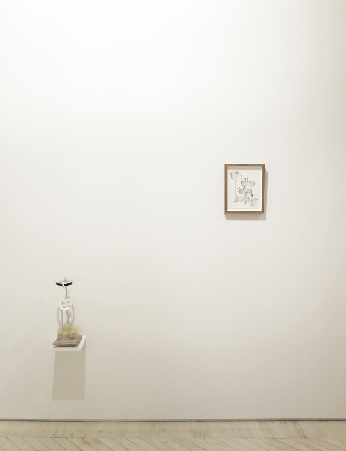 Installation view: Allison Branham, basement huge and white with a thousand tables, 2014; Natasha Ghosn, 2 of Cups, 2013 - small sculpture on a wall shelf and small graphite drawing on the wall.