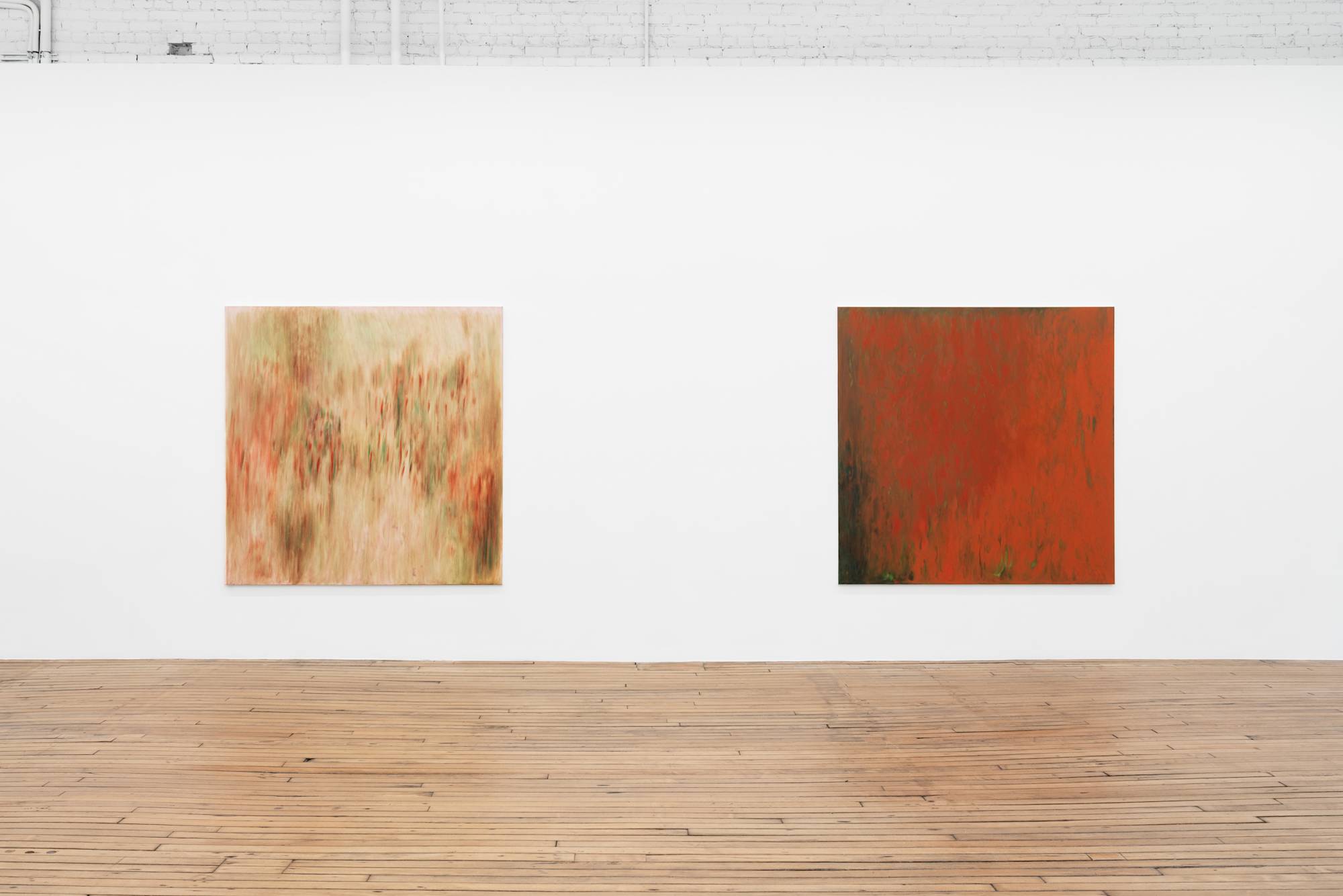 Two large square abstract paintings installed close to each other on a long gallery wall.