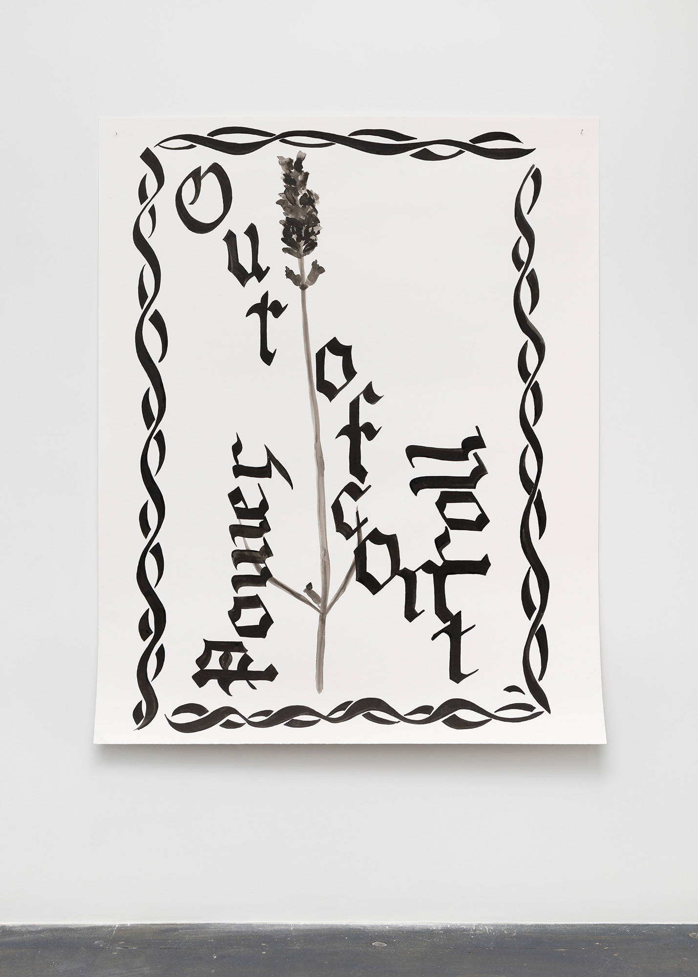 A large, abstract, black ink drawing on paper hangs on a wall. Letters arranged in different directions spell out "Out of Controll". The letter "S" repeats to create a border around the drawing.