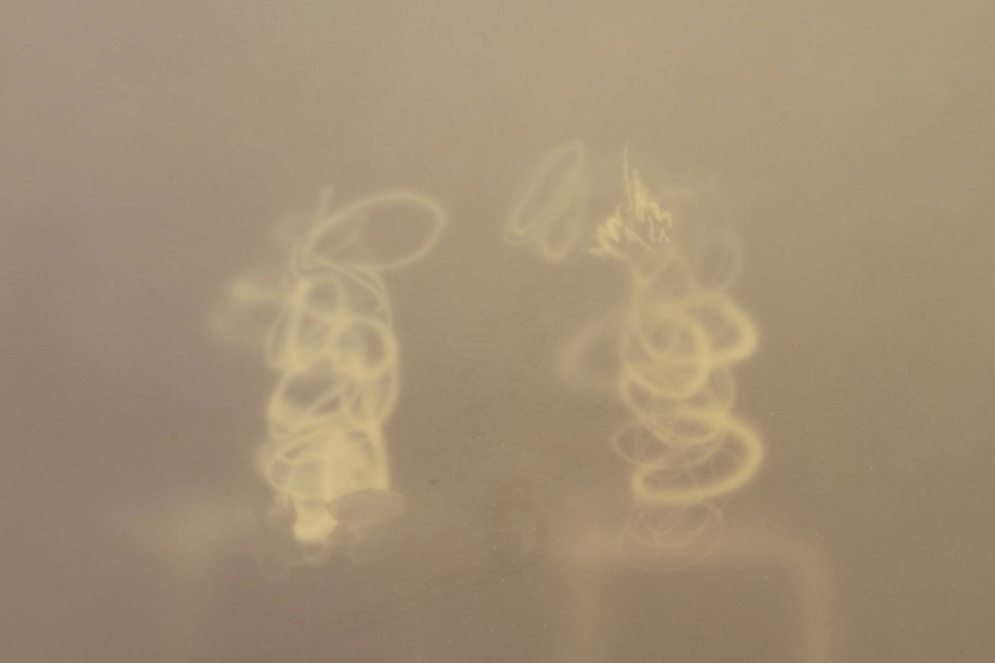 A close-up shot of a series of airbrush marks in an abstract painting.