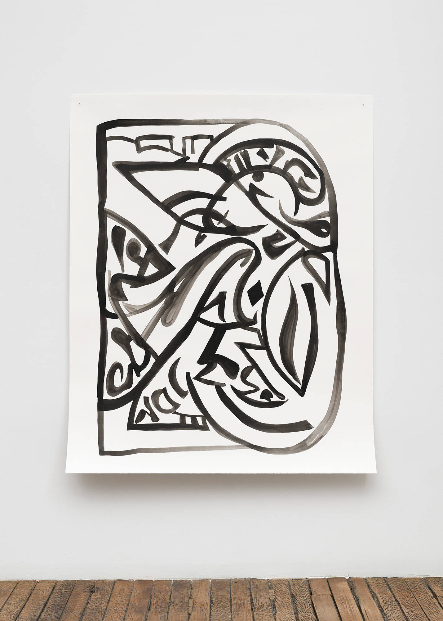 A large, abstract, black ink drawing on paper hangs on a wall. Due to the use of AI to create it, it appears that there are words in gothic font visible in the drawing, but they are not legible.