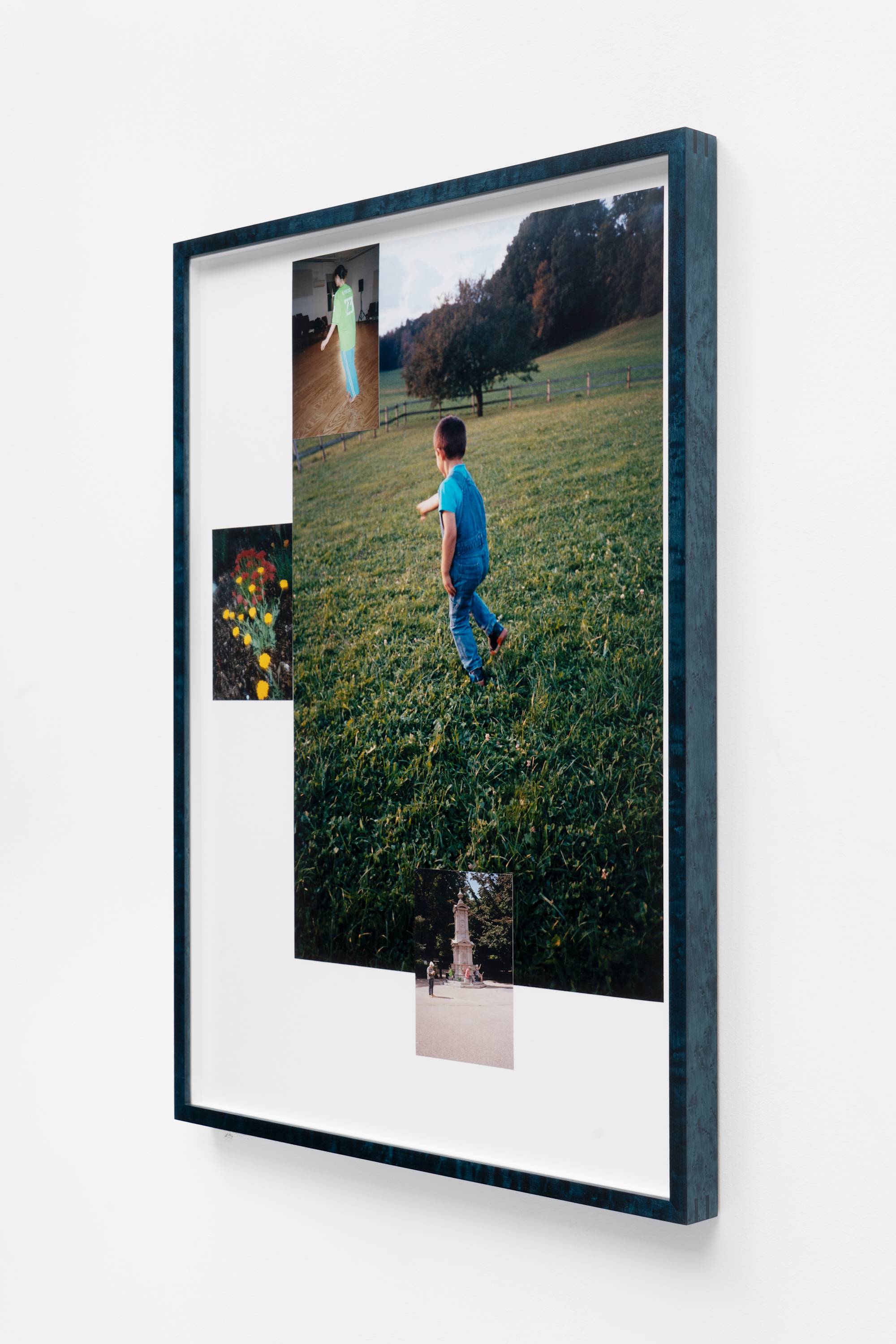 In a wood frame, a series of photographs and mementos are arranged together, photographed from the side.