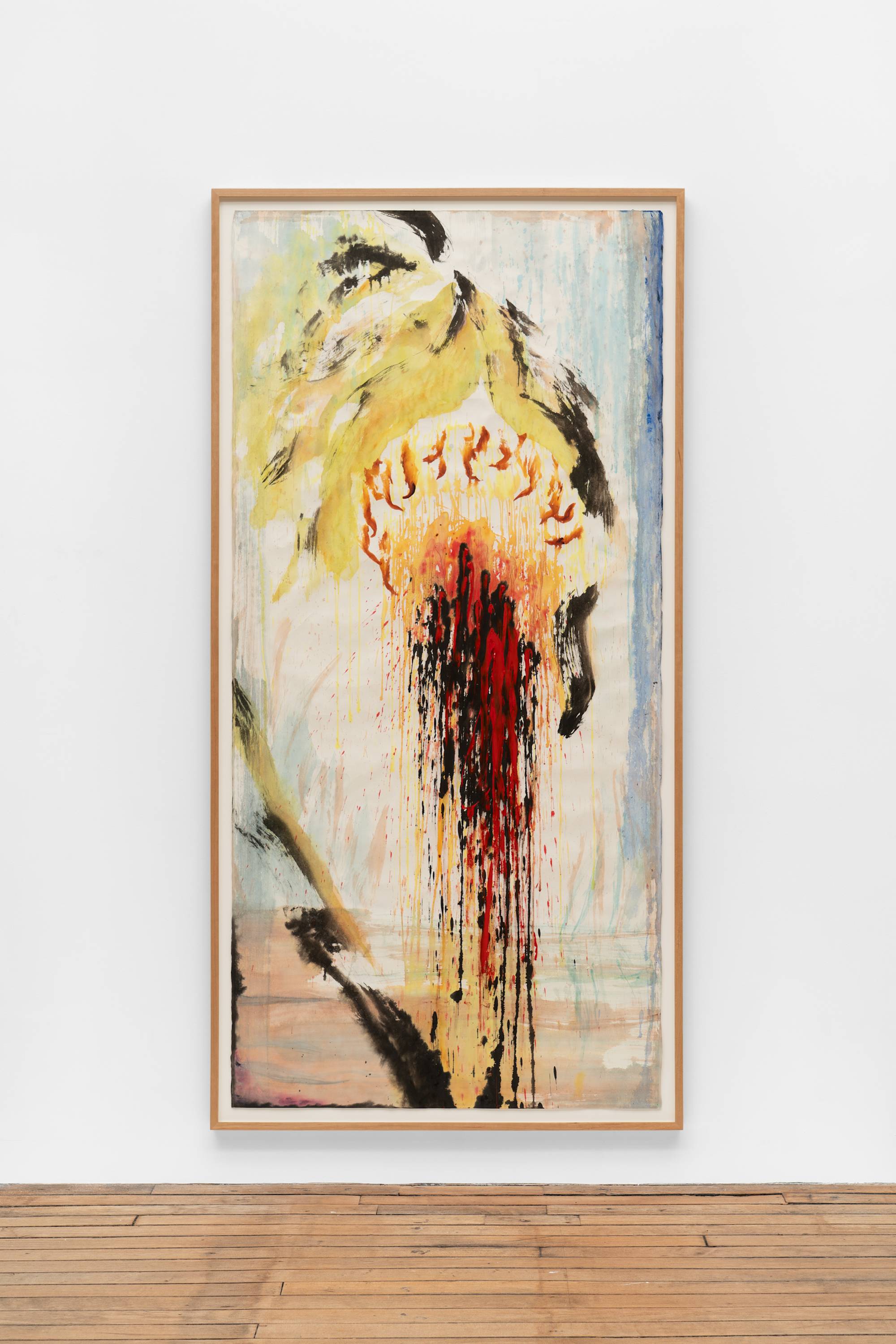 An ink painting of a decaying sunflower, with pale green and black leaves and stem, and an orange, red, and black center that spills down from the middle of the composition to the bottom. The background has washes of blue and light brown. The frame and the wall the work is mounted on is visible in the shot.
