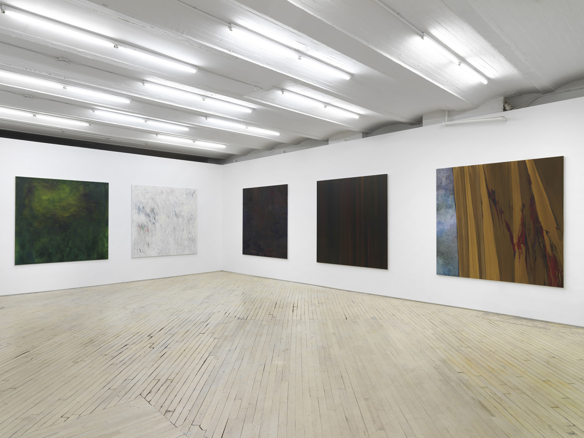 Five large, abstract, square paintings hung evenly spaced from one another in a large gallery space.