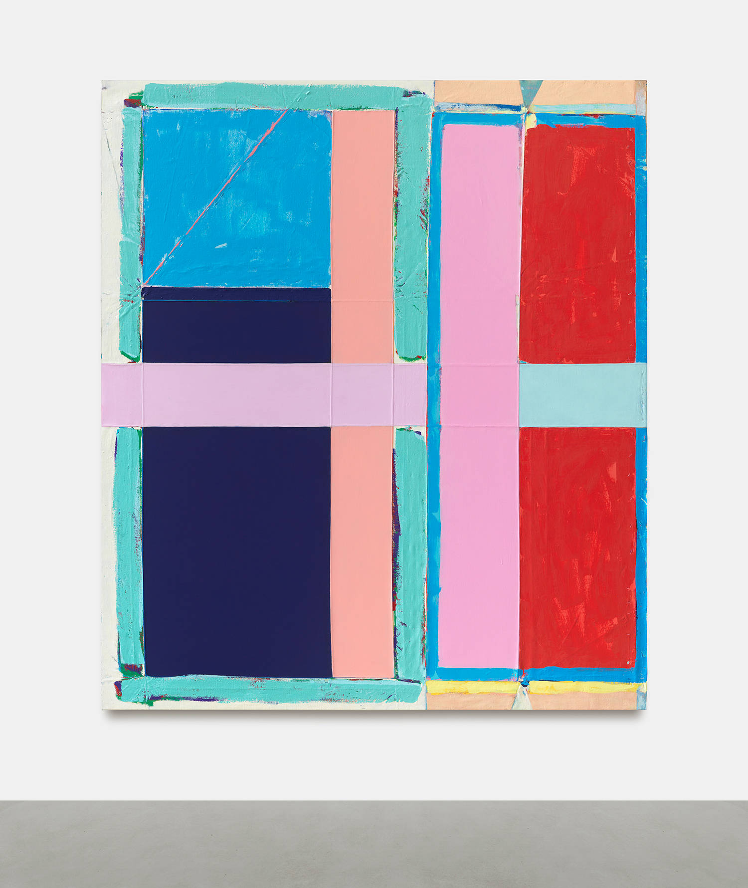 A large abstract painting on a white wall with gray floor below. The painting is a combination of discreet abstract shapes painted in bold colors. The outstanding colors are hues of red, pink, blue, and green. The paint is thick and brushy and the canvas is rough with creases.