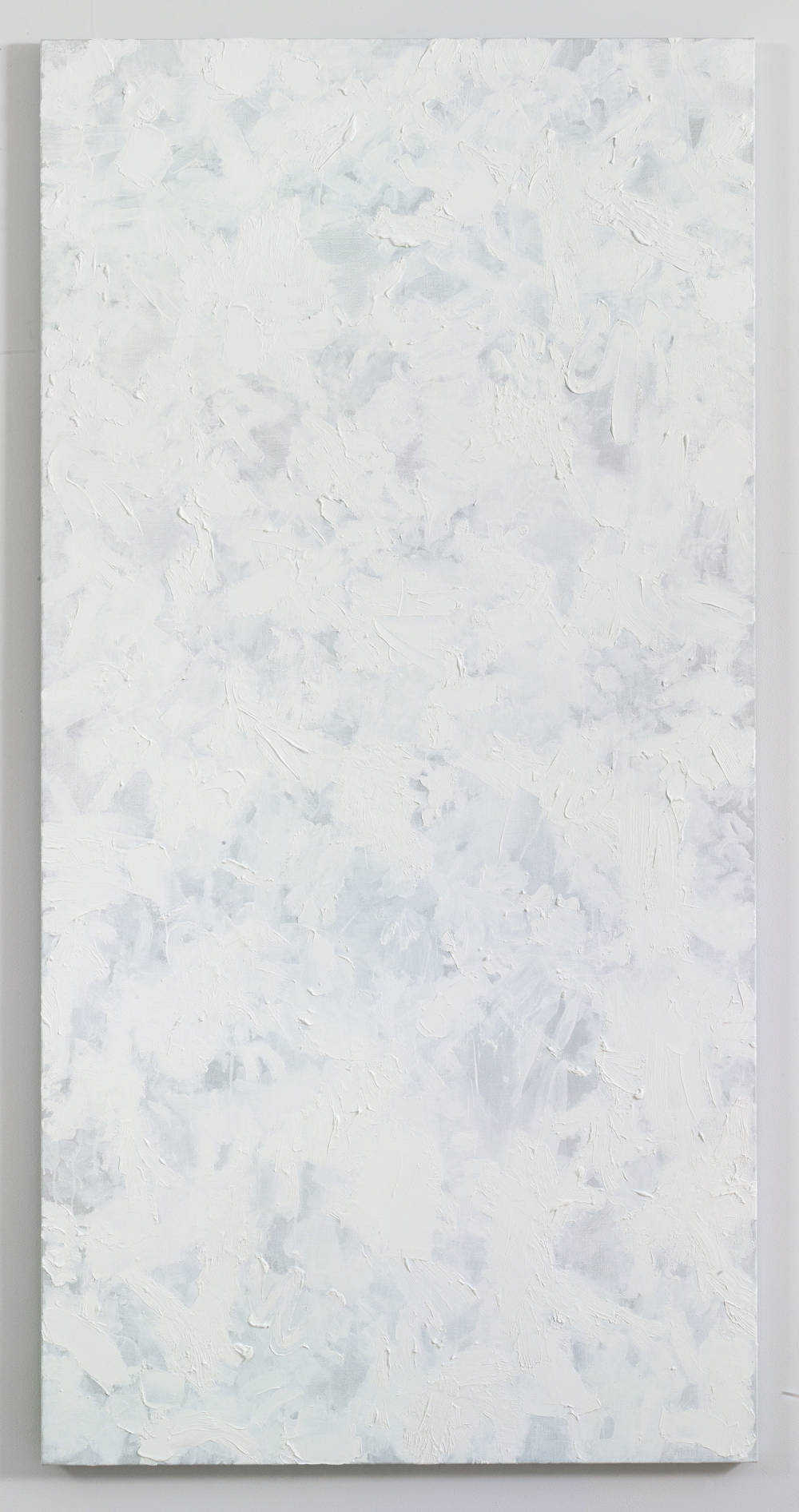 A large abstract painting with numerous swatches of white paint on top of one another. The paint is applied in thin layers .