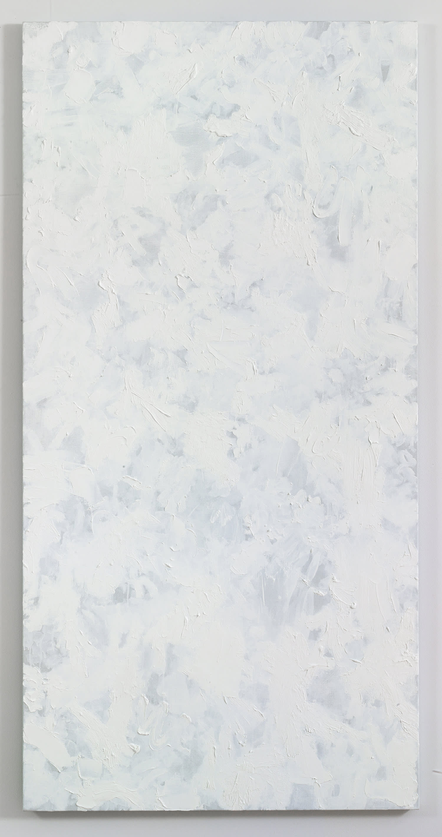 A large abstract painting with numerous swatches of white paint on top of one another. The paint is applied in thin layers .