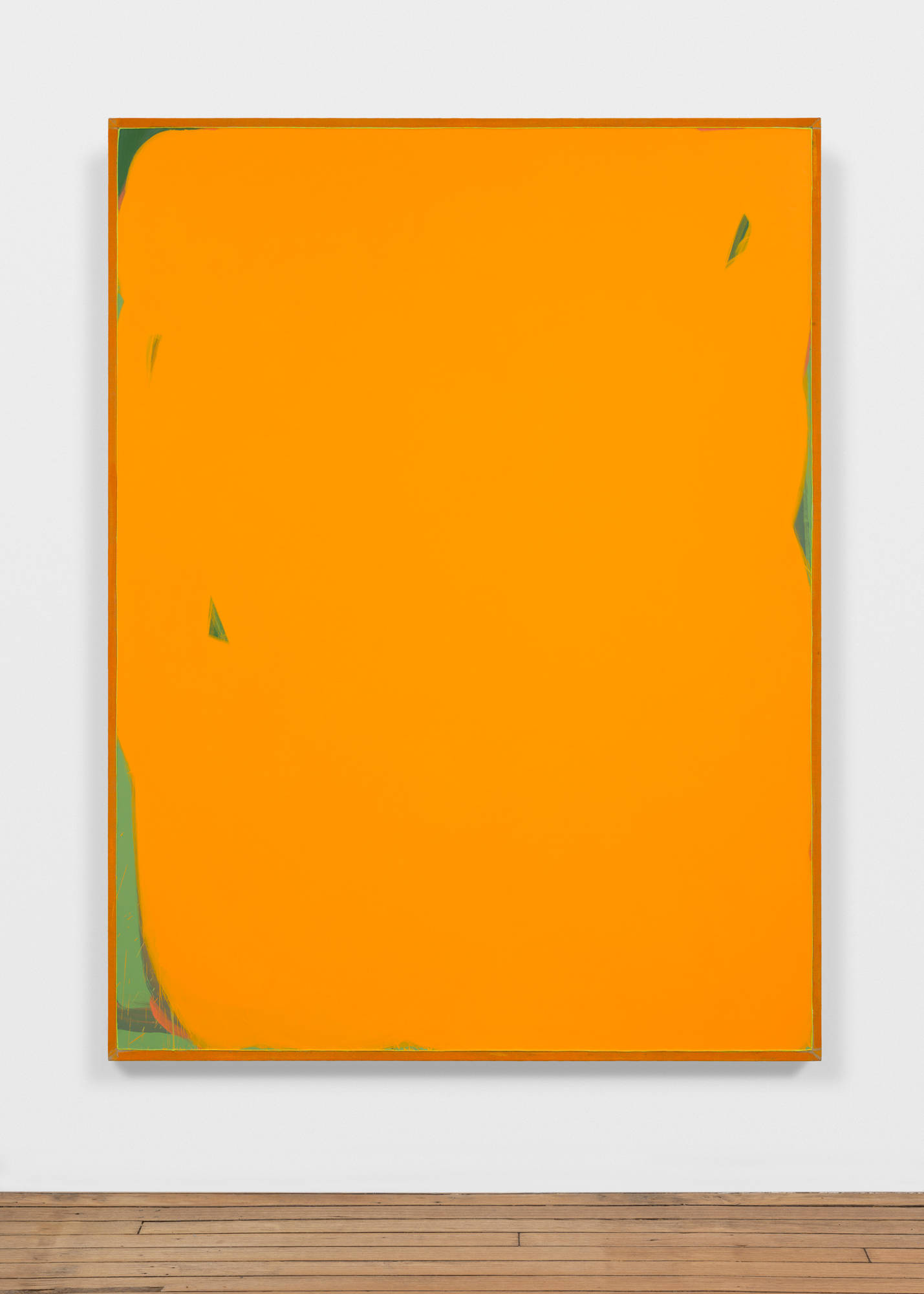 A large orange monochromatic painting with accents of green throughout the surface.