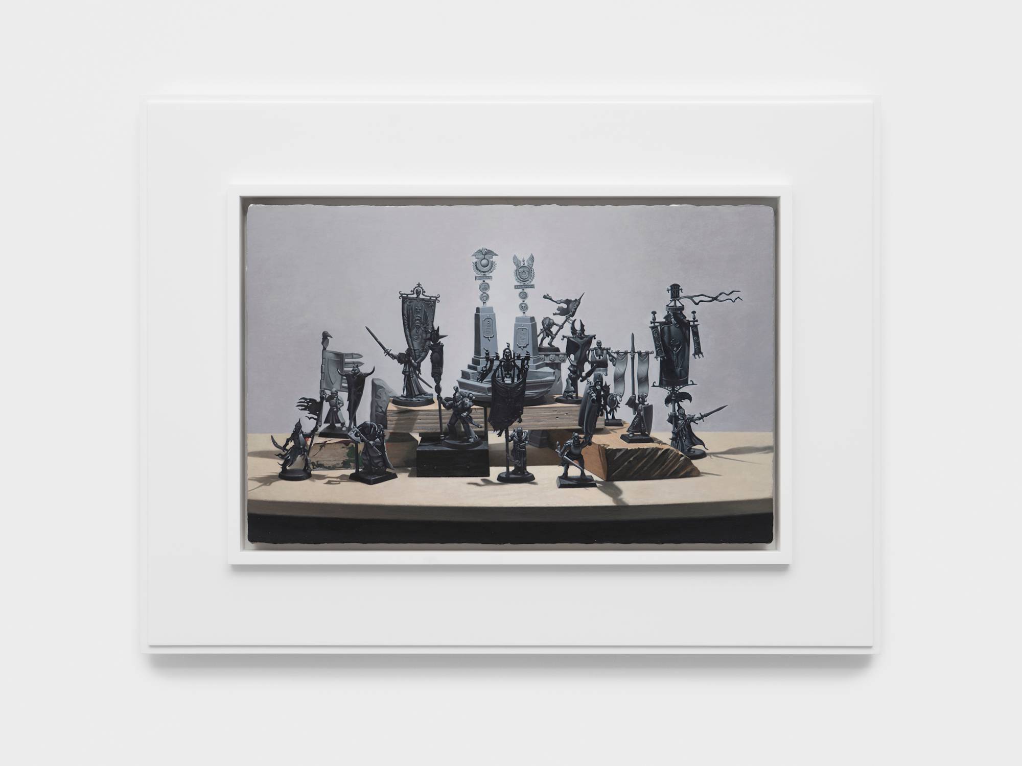 Realistic, detailed painting of several un-painted warhammer figurines on a table top arranged on various wood blocks. The painting is framed in a white artist frame.