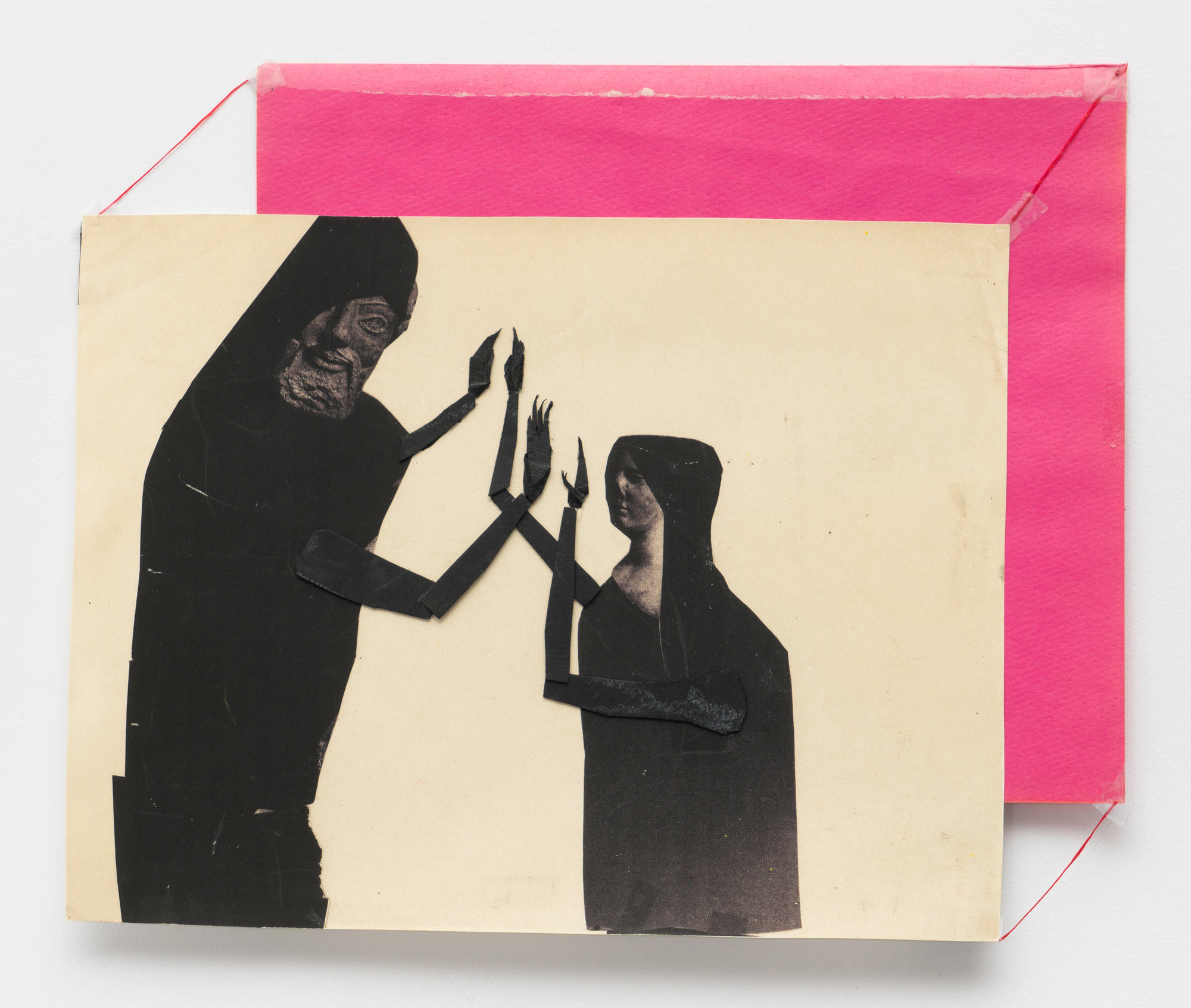 2 figures in black cloaks and hoods clap their hands with one another against an off white sheet of paper. Offset up and to the right behind the white paper is a sheet of hot pink construction paper. Red string bridges the corners of the two sheets of paper.