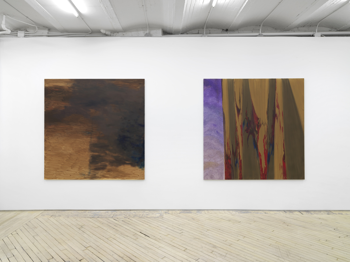 Two large square abstract paintings installed close to each other on a long gallery wall. 