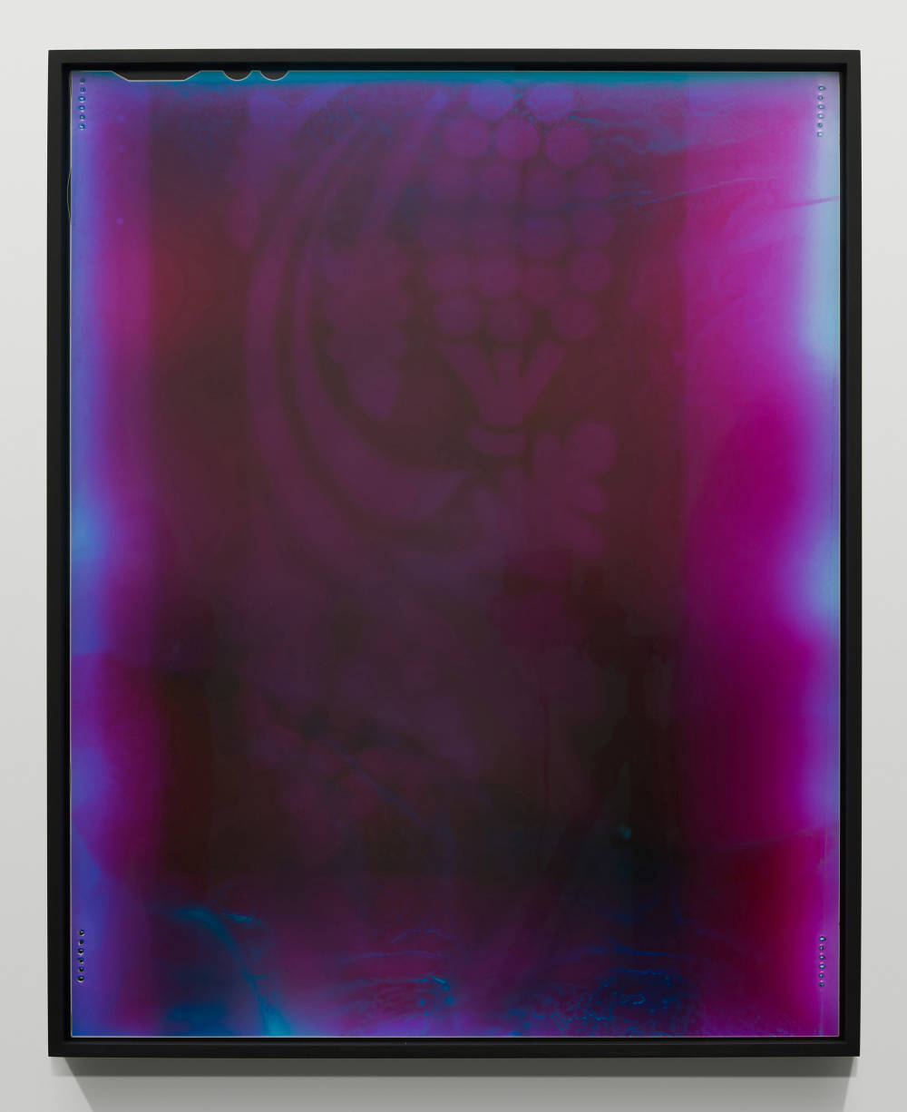 Image of photograph by Ketuta Alexi-Meskhishvili depicting and mostly purple image with a light blue tint around the edge of the image. There is a decorative pattern visible deep within the purple of the image. 