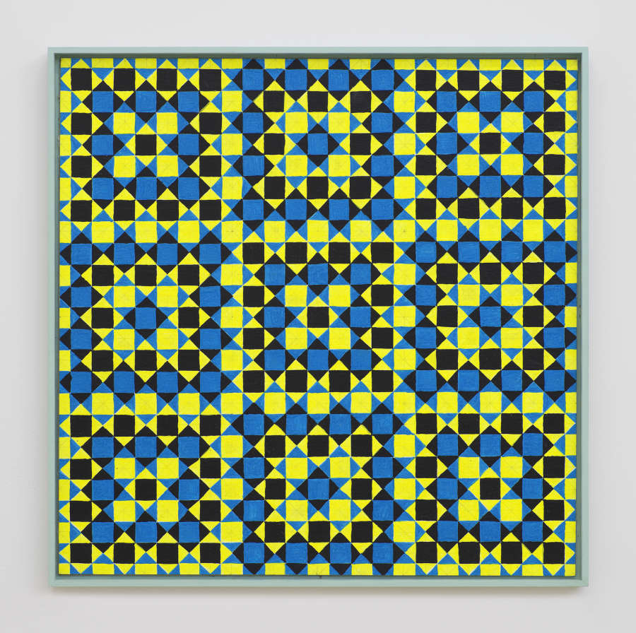 On a white wall a painting depicting a grid of crisscrossing lines generating many repeating rectangles, and triangles. The dominant colors are hues of green, yellow, blue, and black. The frame is painted green.