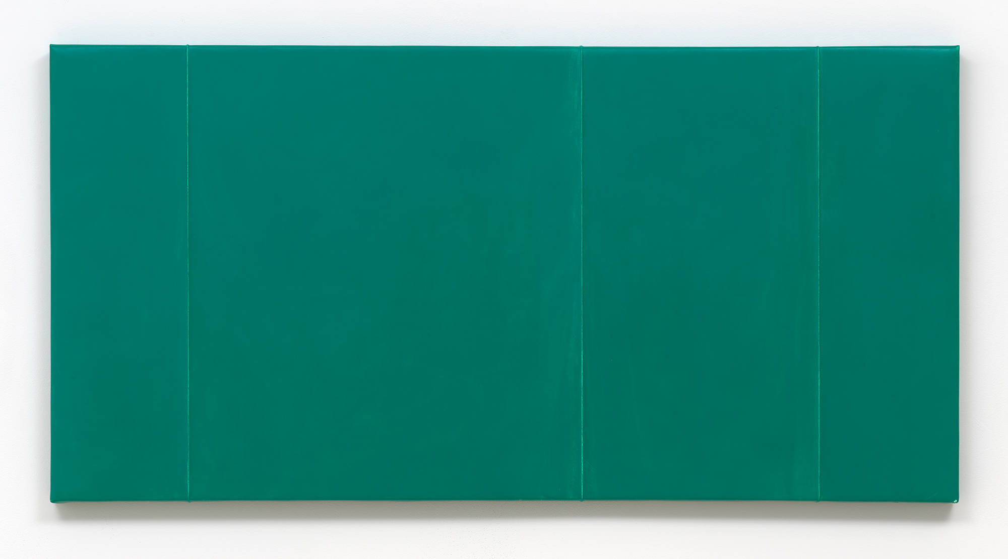 Close-up of a green monochromatic painting with four vertical ridges.