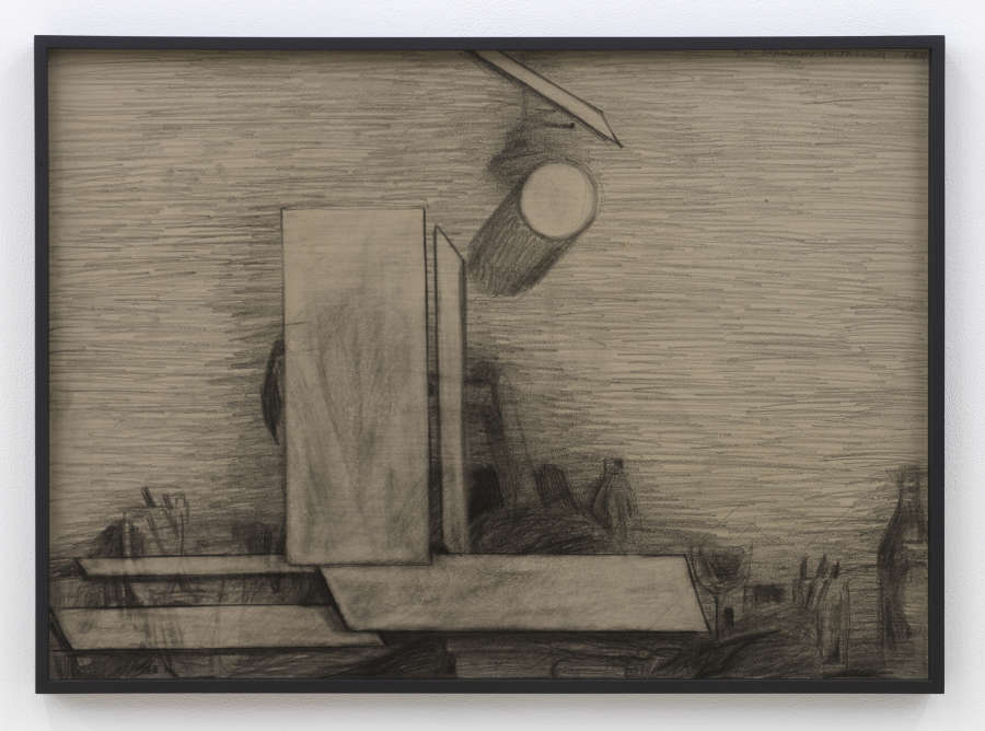 Image of a graphite drawing within a black frame, the glass is tinted an amber hue. There are a number of shapes: cylinder, rectangle, trapezoids, sitting on what is to be believed as a desk or workstation, with a beer bottle visible to the right of the shapes.  