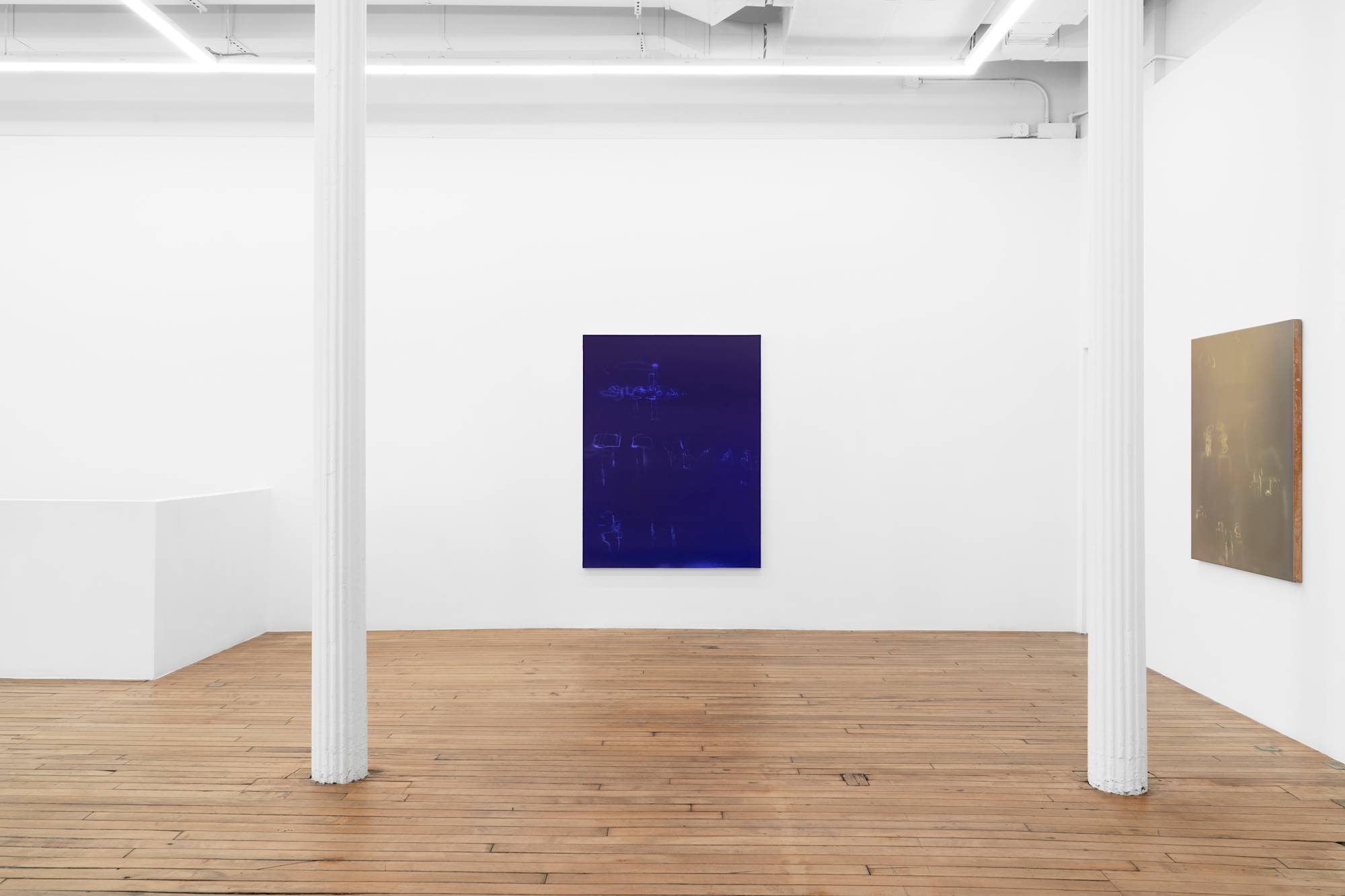 In a large gallery space, two vertical abstract paintings are spaced far apart, both depicting a series of airbrush painted marks in shifting grounds of color.