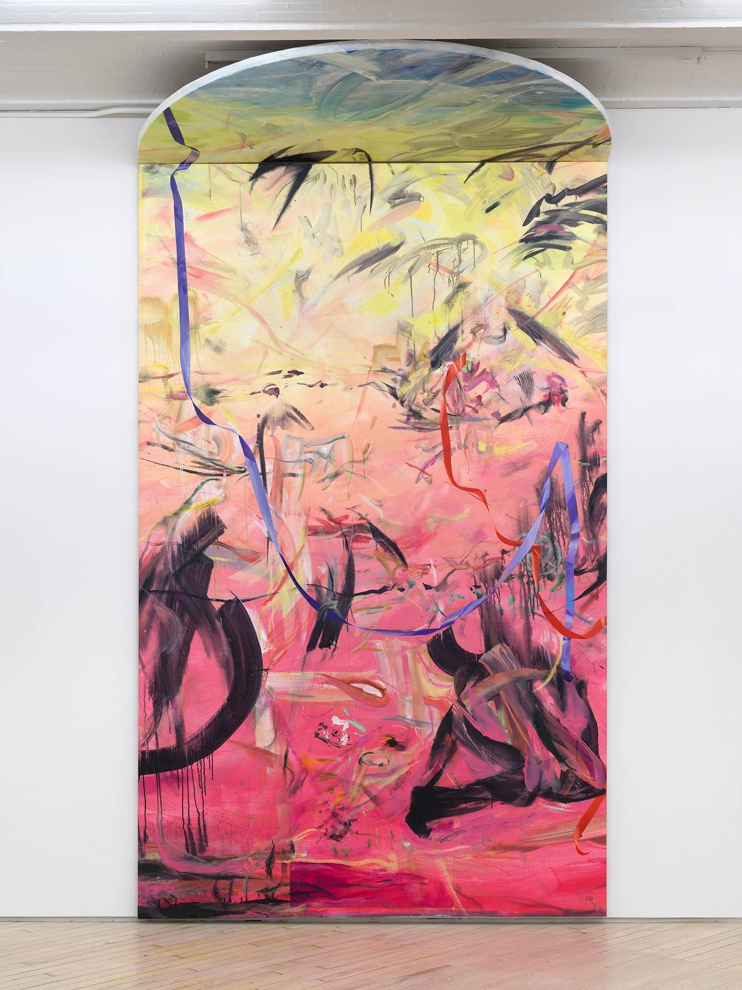 Image of a painting by Tom Holmes that shows one large columned painting that touches the ceiling with a semi-circular top canvas. The painting is mostly made with a rainbow of hues and abstract painterly marks.