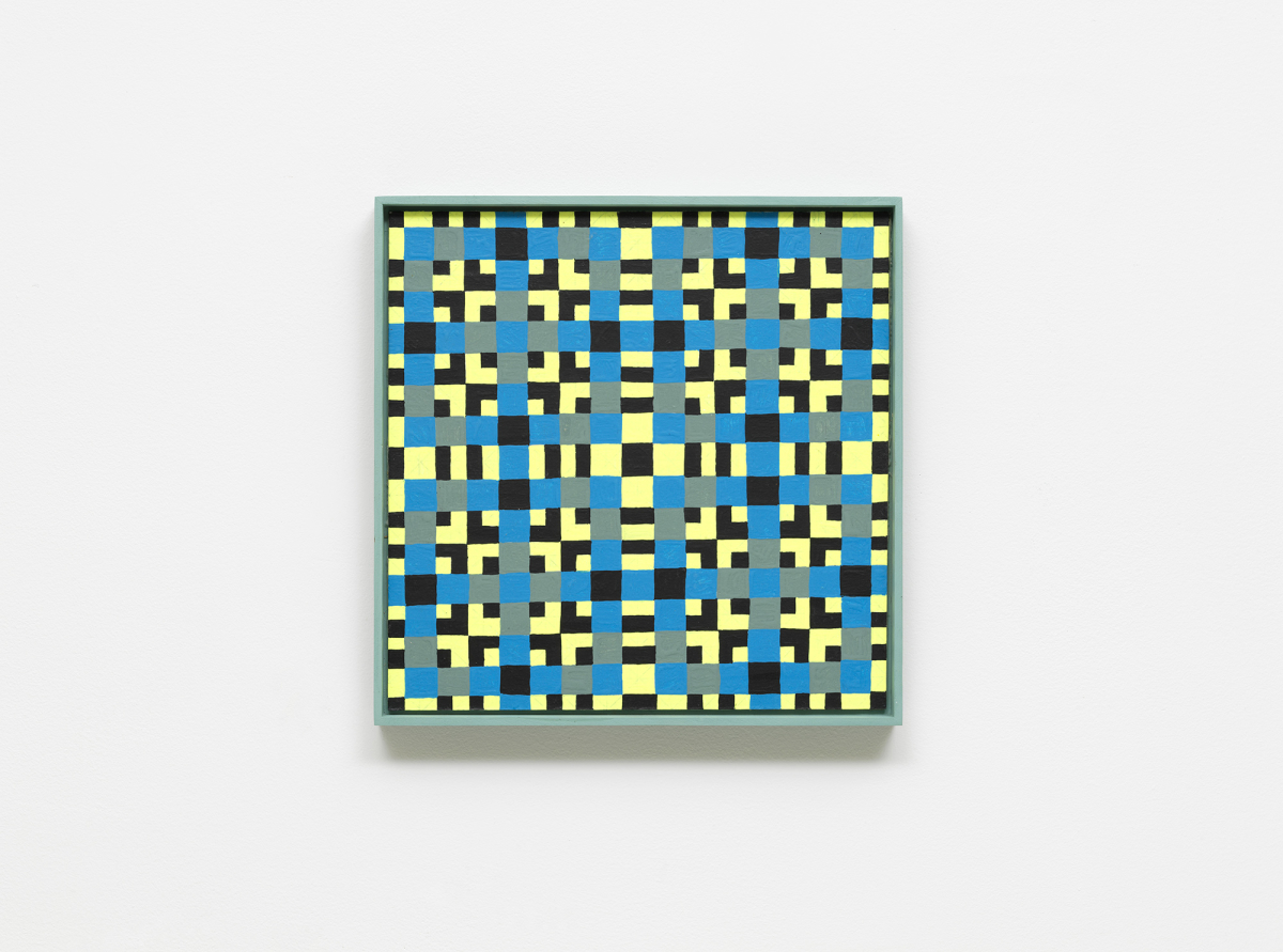 A colorful, intricate grid painting installed on a white wall.