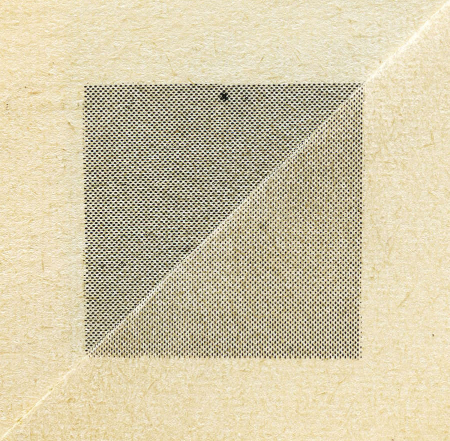 Image of the folded corner of the yellowed pages of a book, with a grey central square made up of two triangles which is the result of the folding -the square is grey made of ben-day dots with a small x at the top of the upper triangle.