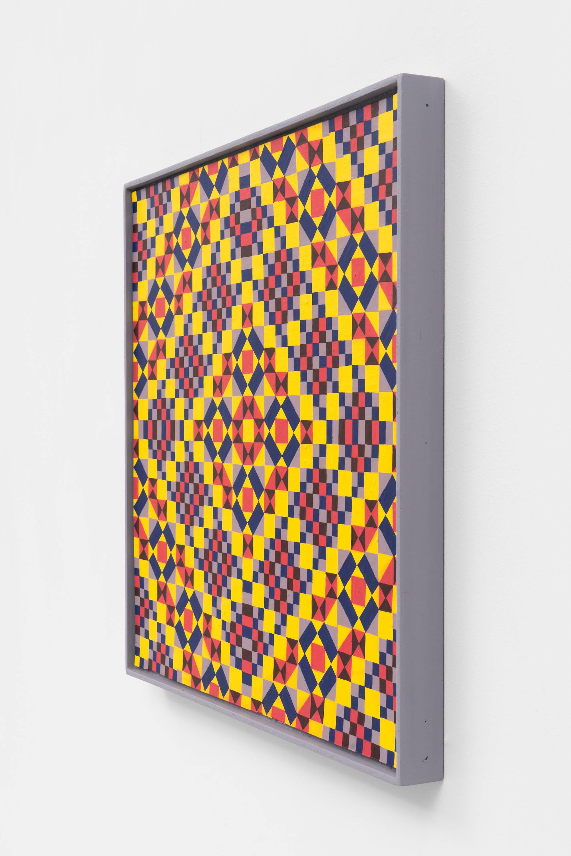 A 3/4 view of a colorful, symmetrical, geometric painting on board consisting of a pattern of repeating diamonds and triangles of yellow, red, and purple, in a purple artist frame.