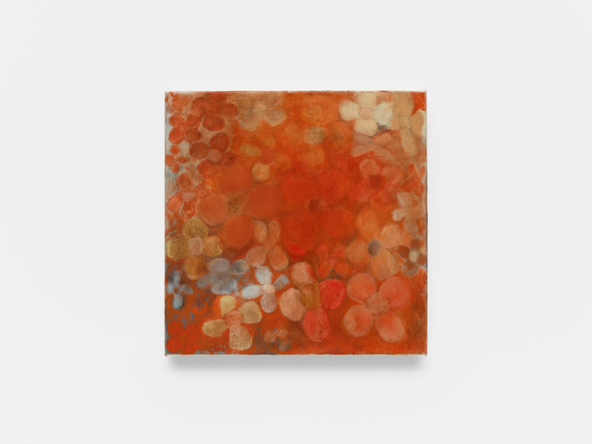 A small abstract painting of flowers in red, orange, and yellow hues.