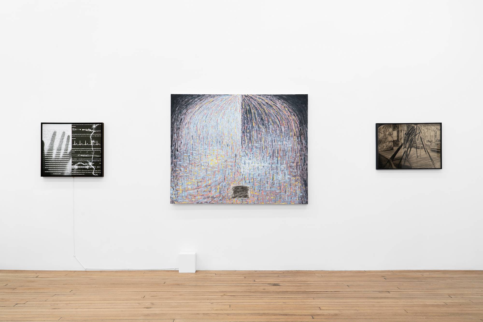 A large, abstract painting of droplets showered in umbrella form depicted in hues of blue, red, and yellow is flanked by a lightbox with graphics of image and text and a charcoal drawing of a train interior.