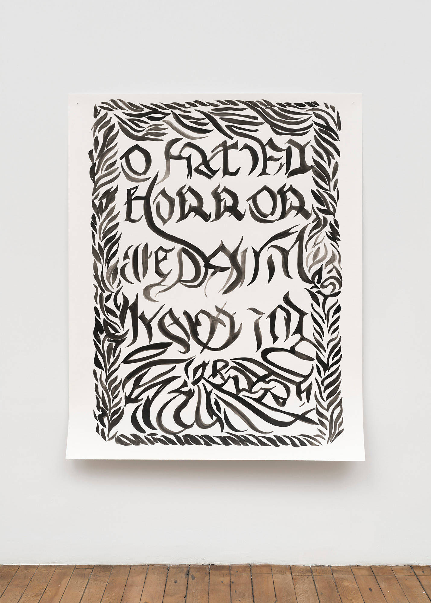 A large, abstract, black ink drawing on paper hangs on a wall. Due to the use of AI to create it, it appears that there are words in gothic font visible in the drawing, but they are not legible.