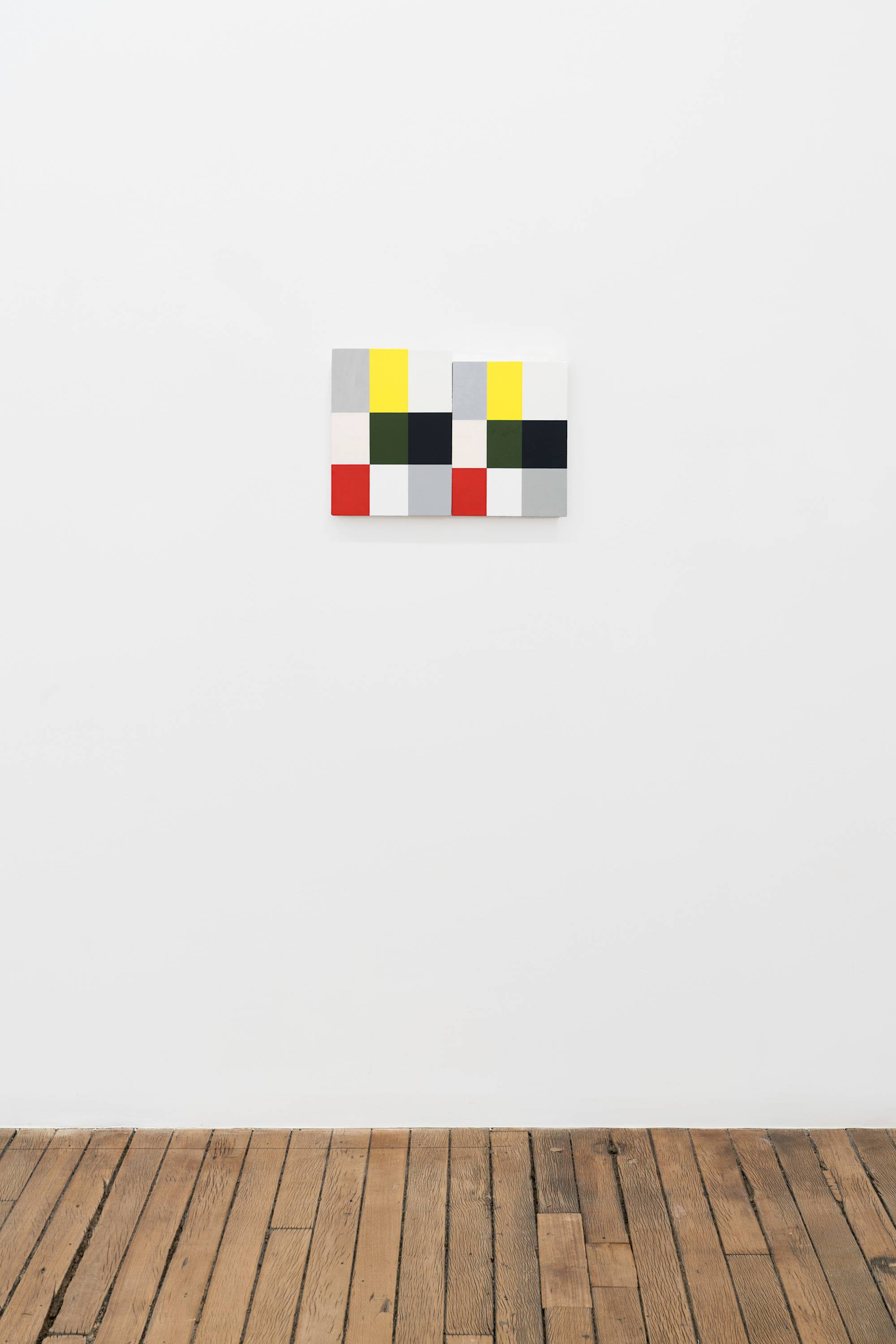 Two Ian Miyamura paintings of red, green, black, white, yellow, grey, and pink squares hang on the wall butting against each other above a wood floor.