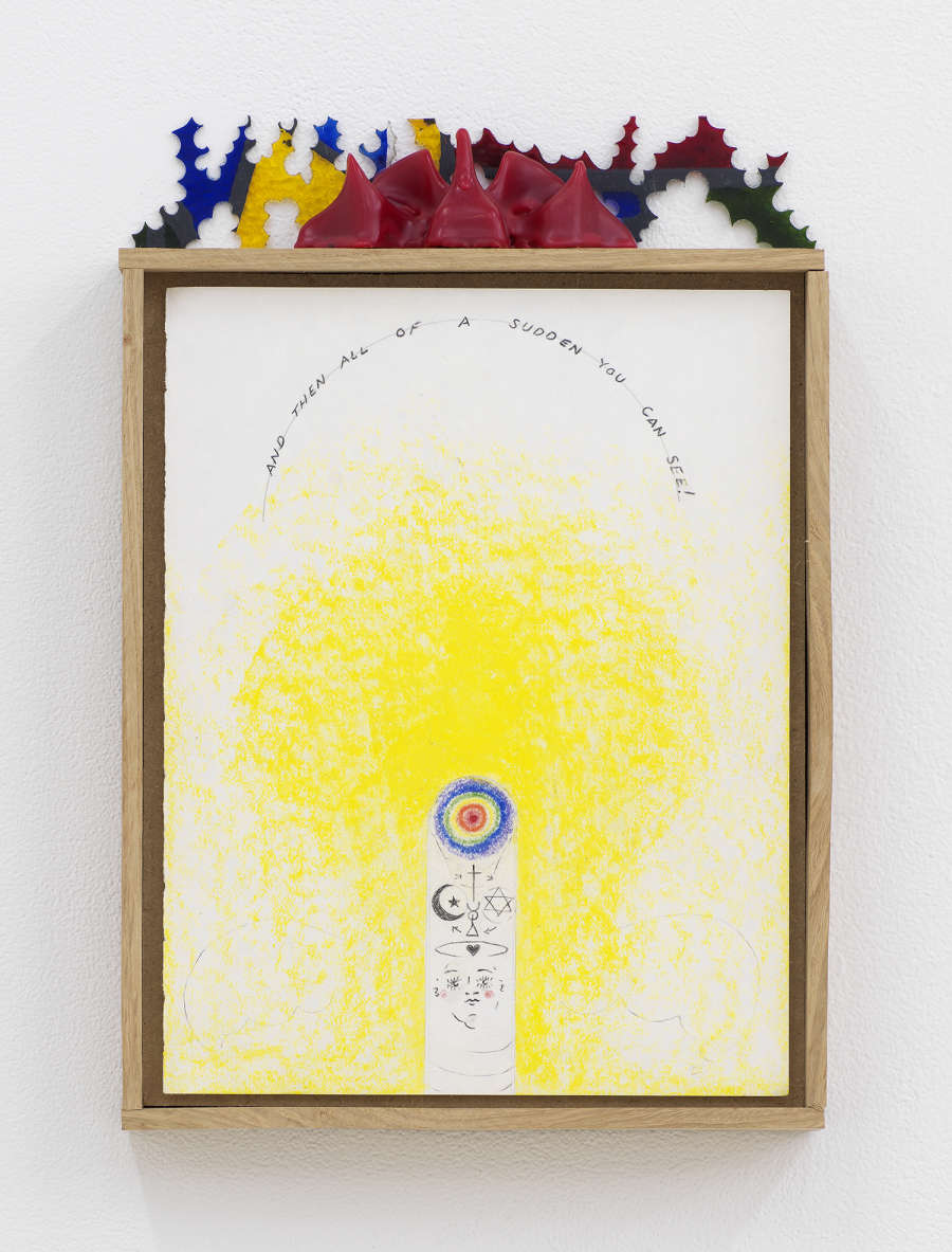 Image of Harry Gould Harvey IV drawing framed in foraged oak wood, depicting lines of text in an arch above a cloudy wash of yellow pigment, with a bullseye near the bottom of the drawing and religious symbols. A decorative red wax form with multicolored plexiglass rests on the top of the frame. 