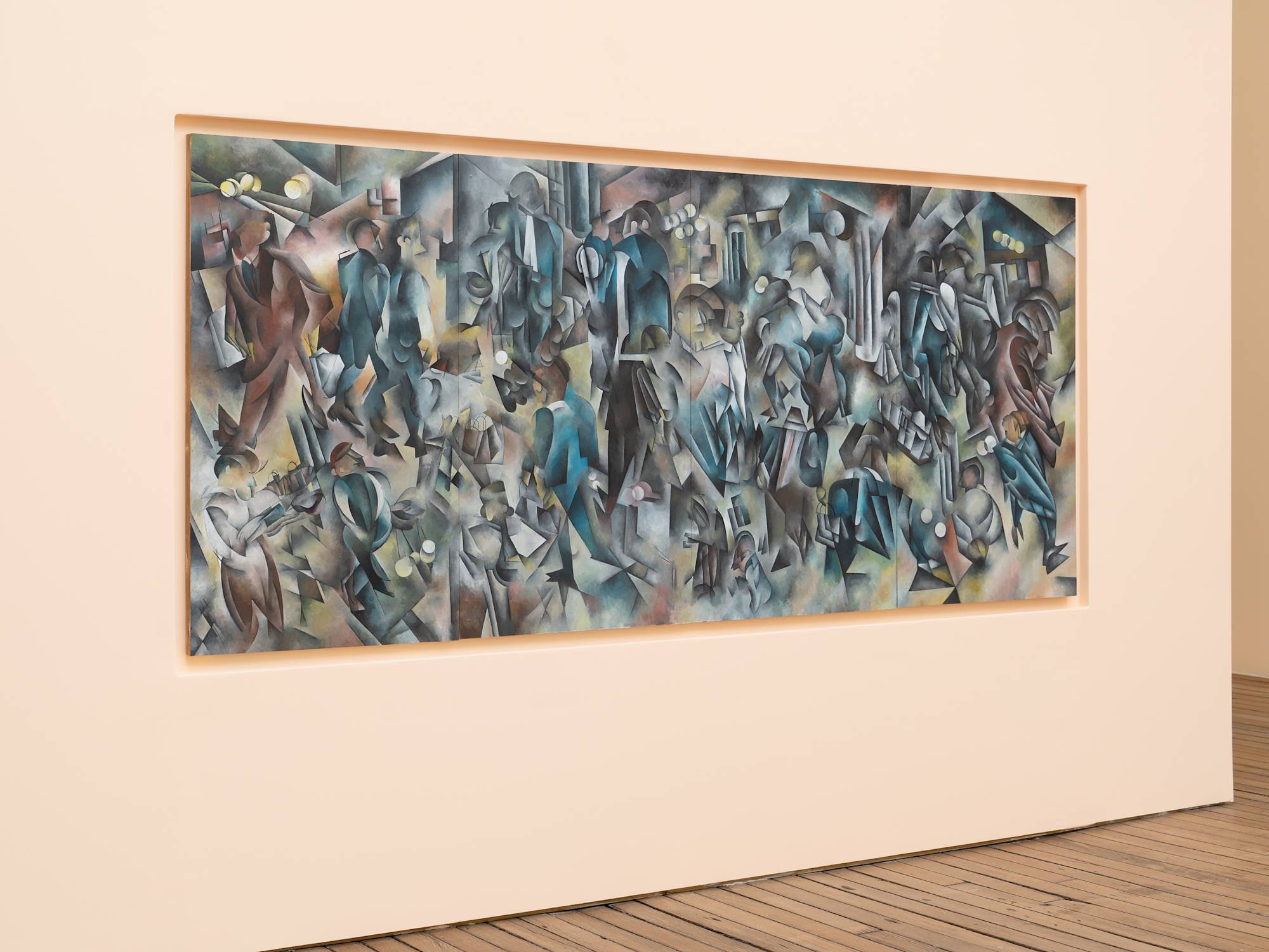 A large, horizontal painting rendered in a Cubist style hangs on a peach colored wall.