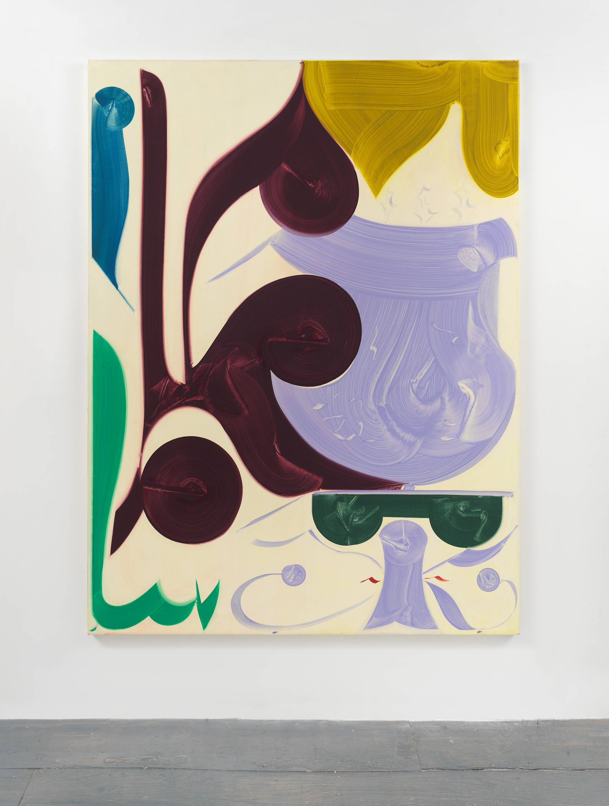 An abstract painting of large, curved shapes with visible brush strokes in blue, green, maroon, violet, gold, and red against a cream background, hangs on a white wall above a grey floor.