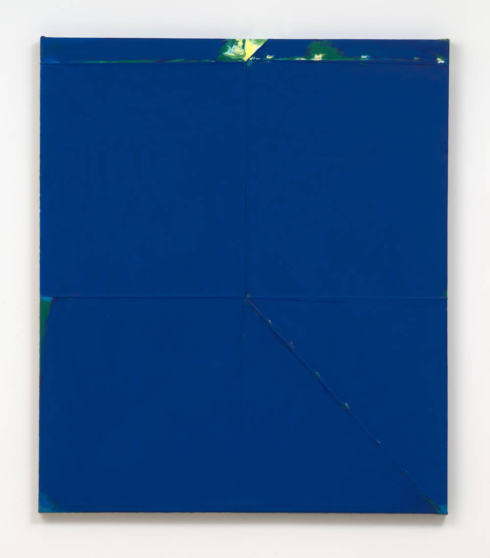 A large blue monochromatic painting with a green accent at the top. 