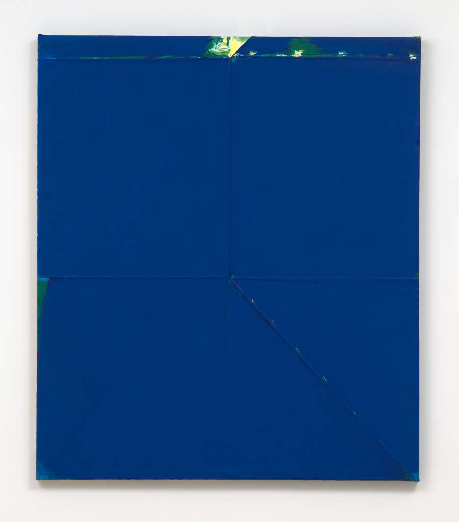 A large blue monochromatic painting with a green accent at the top. 