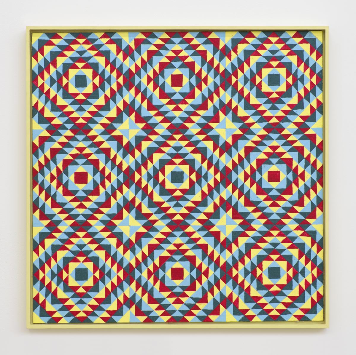 On a white wall a painting depicting a grid of crisscrossing lines generating many repeating rectangles, and triangles. The dominant colors are hues of yellow, red, and blue. The frame is painted yellow. 

