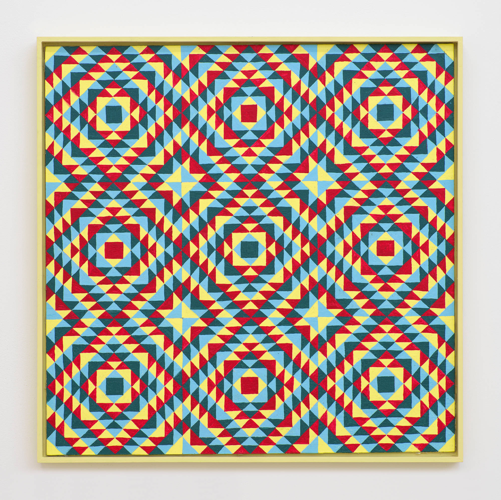 On a white wall a painting depicting a grid of crisscrossing lines generating many repeating rectangles, and triangles. The dominant colors are hues of yellow, red, and blue. The frame is painted yellow.