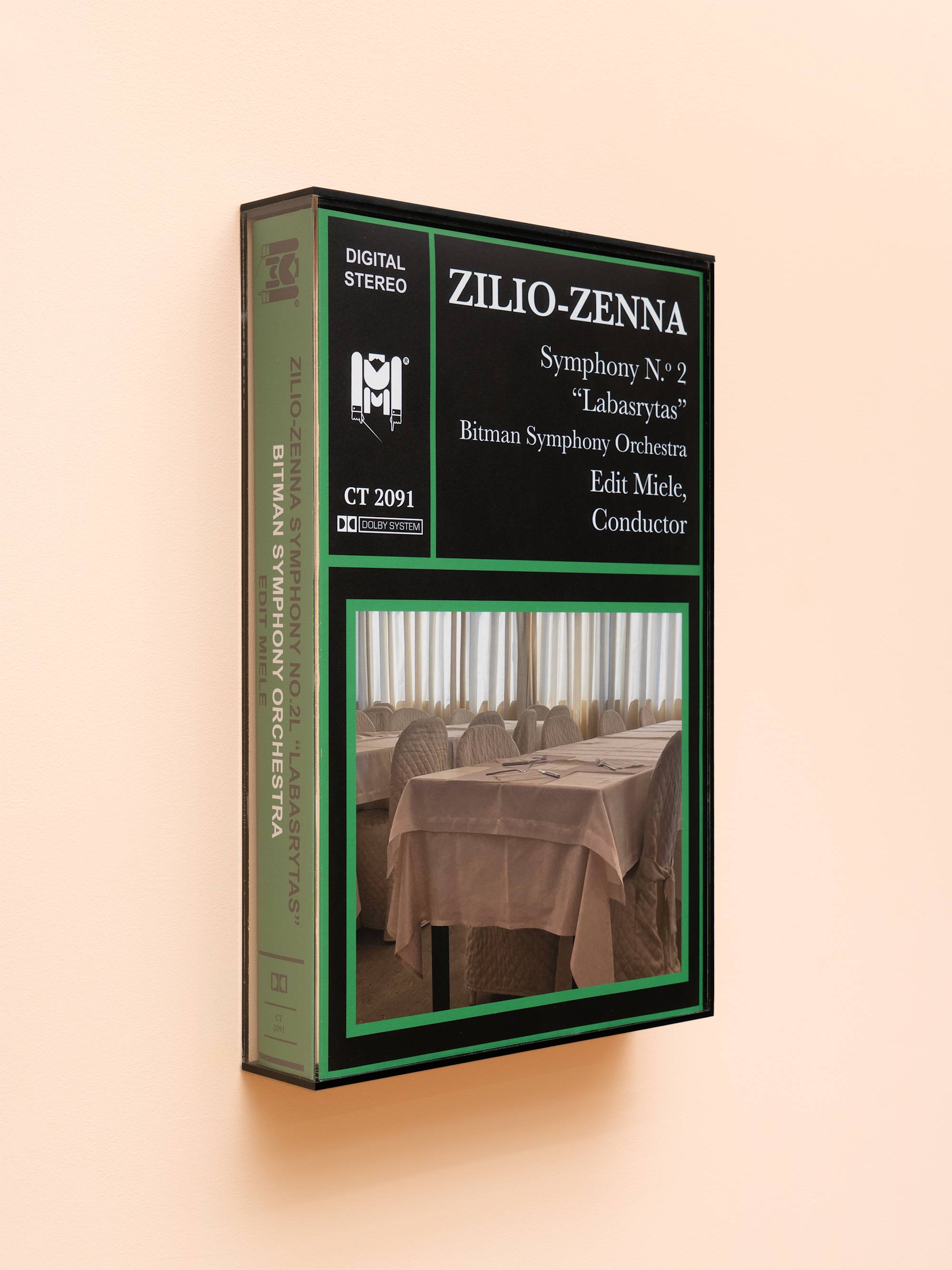 Oversized audio cassette case featuring an image of a restaurant interior.