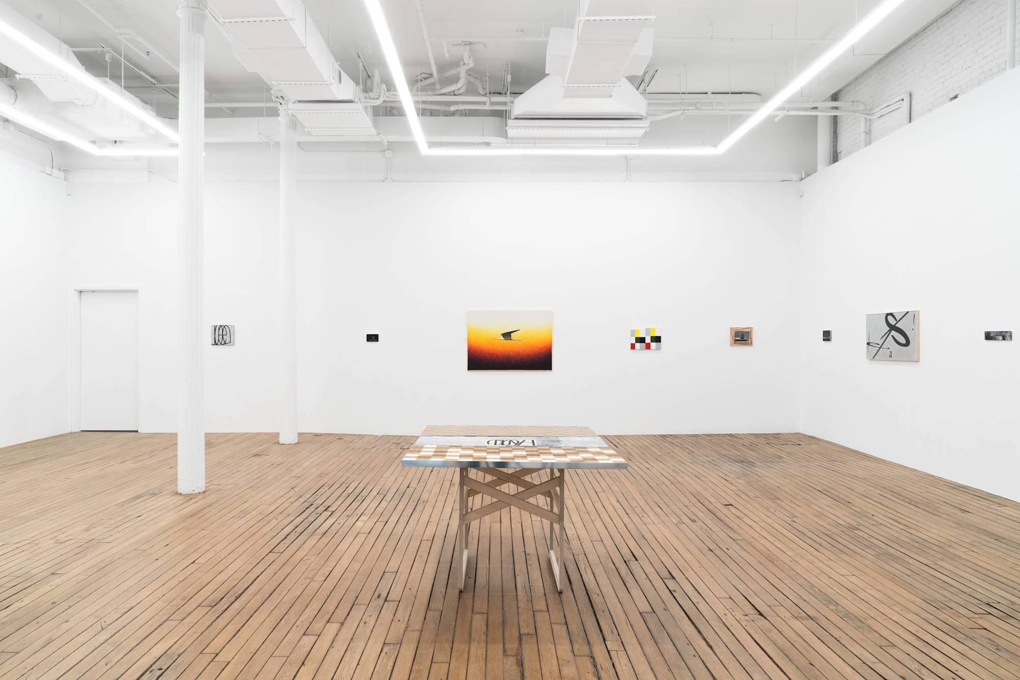 View of gallery with 8 Ian Miyamura paintings hanging on the wall, evenly spaced. A table sculpture sits in the center of the gallery.