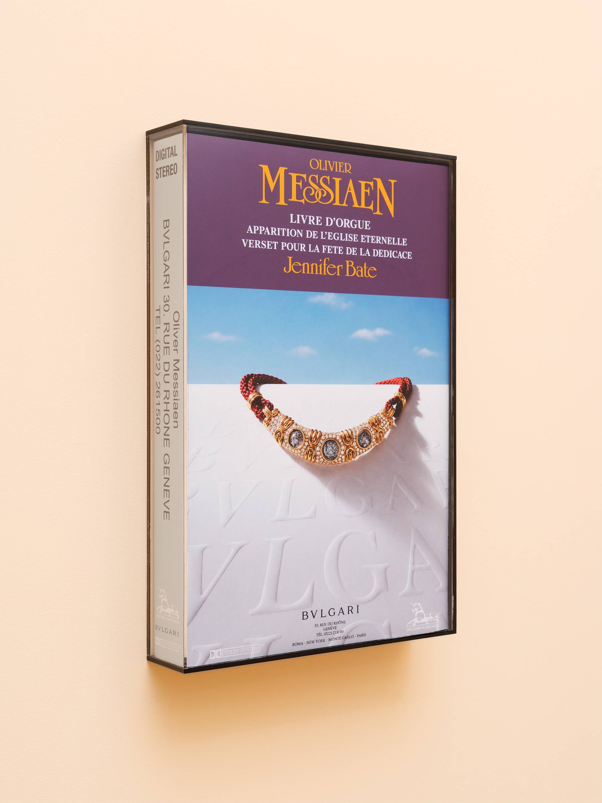 Oversized audio cassette case featuring a bvlgari necklace ad.
