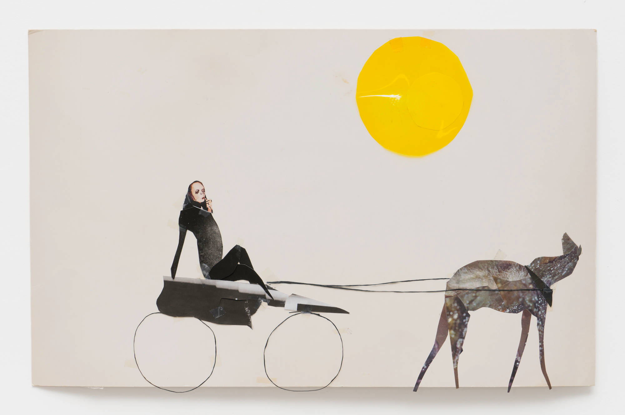 A collage on white paper depicts a figure in a buggie being drawn by a four legged animal. A transparent plastic yellow circle hangs in the sky, indicating the sun.