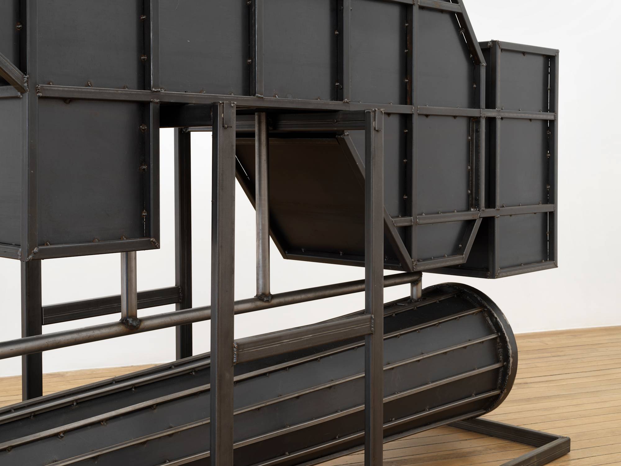 A close up view of the side of a large steel sculpture.