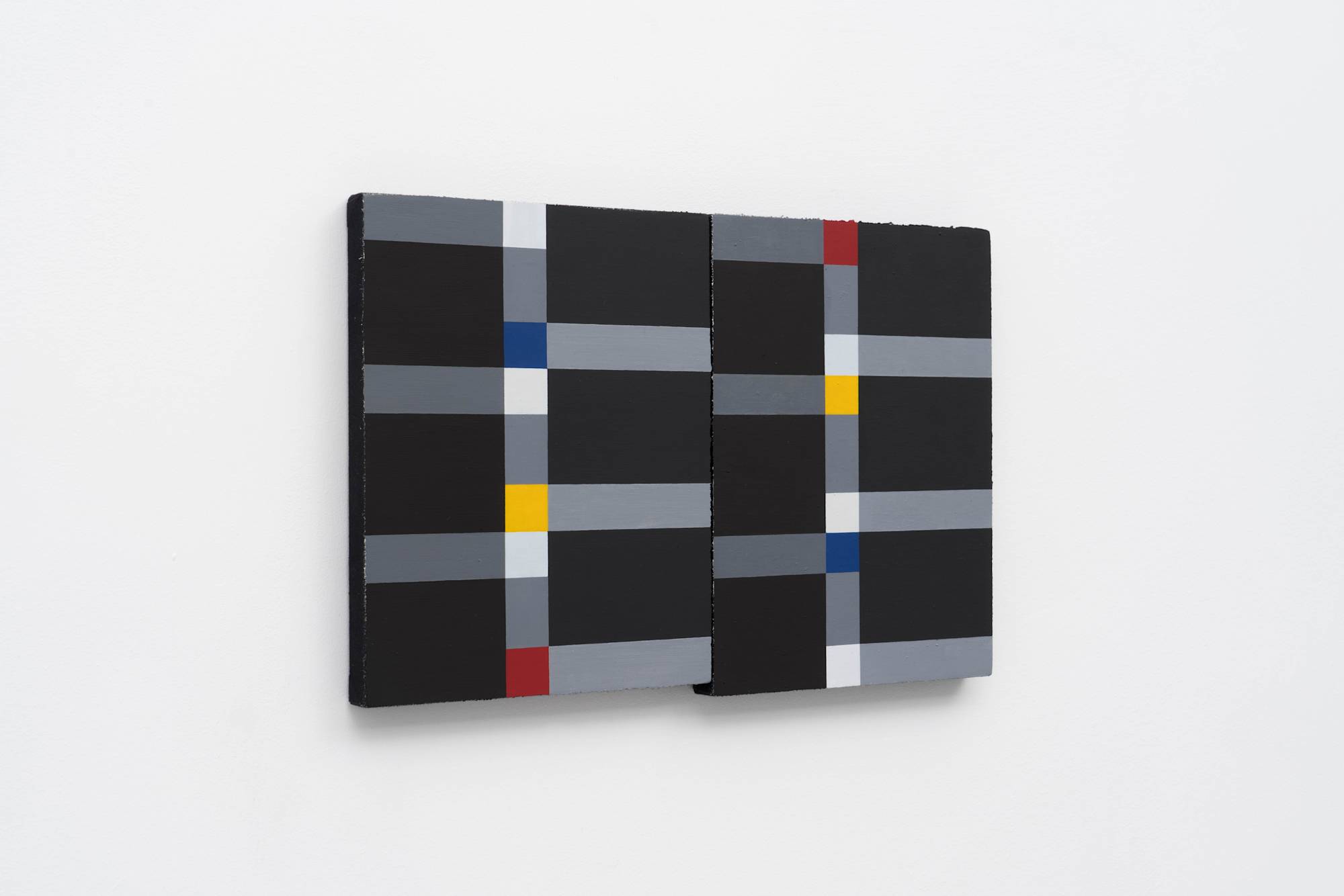 Three quarter view of two abstract Ian Miyamura paintings of red, yellow, blue and white squares connected by grey rectangles on a black background hang on the wall butting against each other.