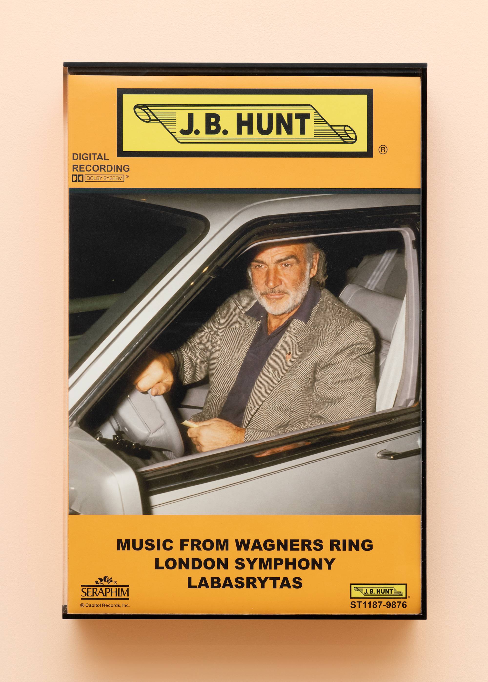 Oversized audio cassette case featuring an image of a Sean Connery driving a car.