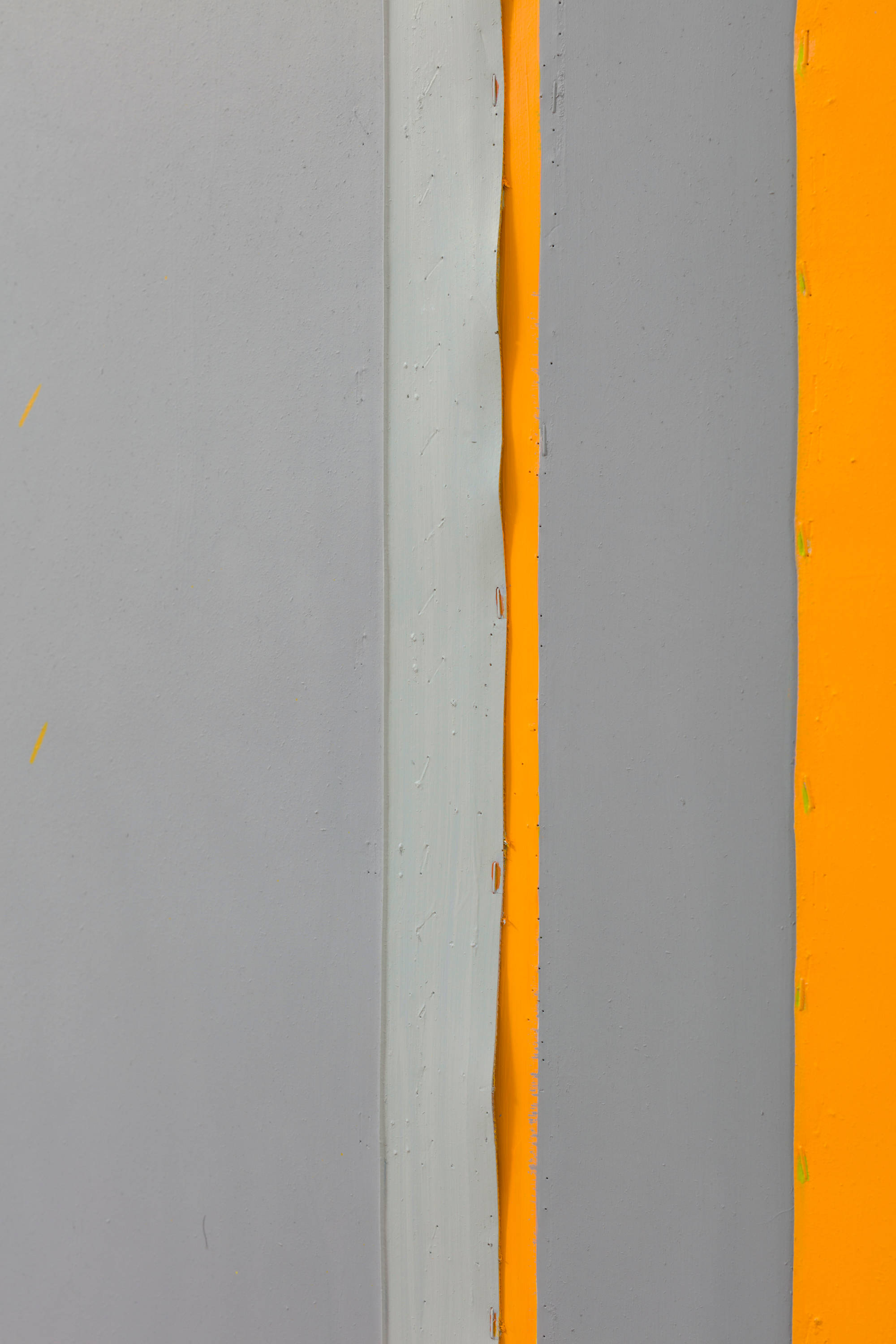 Detail of a large abstract painting depicting numerous vertical bands of color in a range of orange, beige, yellow, and grey.