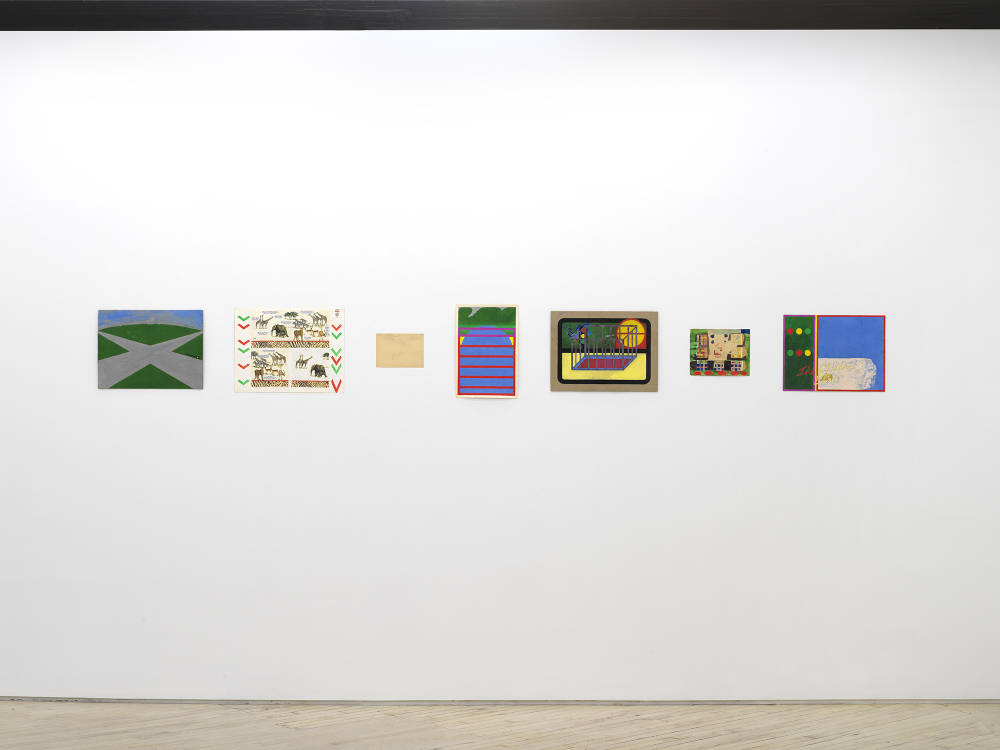 In a gallery space, a series of small works on paper are installed close together on a white wall. The drawing are clustered in a group. The drawings depict abstracted, cartoon-like character scenes. The sizes of the paper vary in length and proportion. 